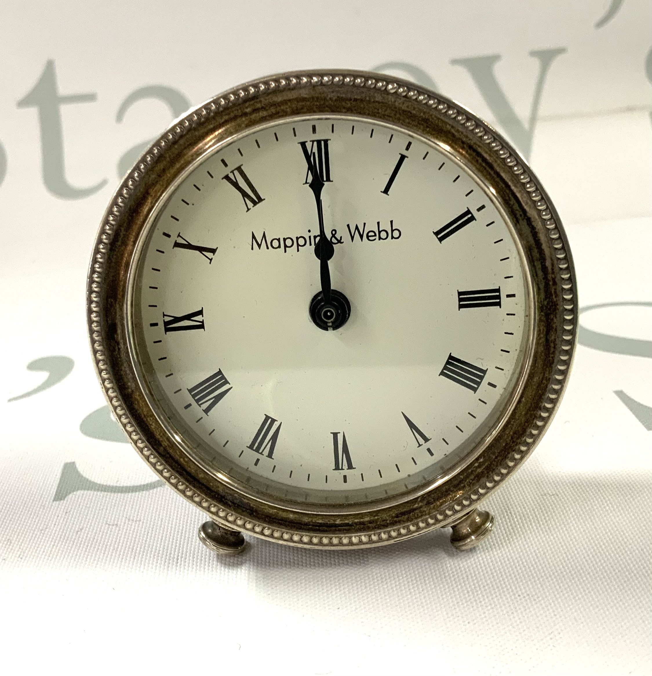 A hallmarked silver Mappin & Webb clock, 6.5cm Diameter. London 1990. (A)