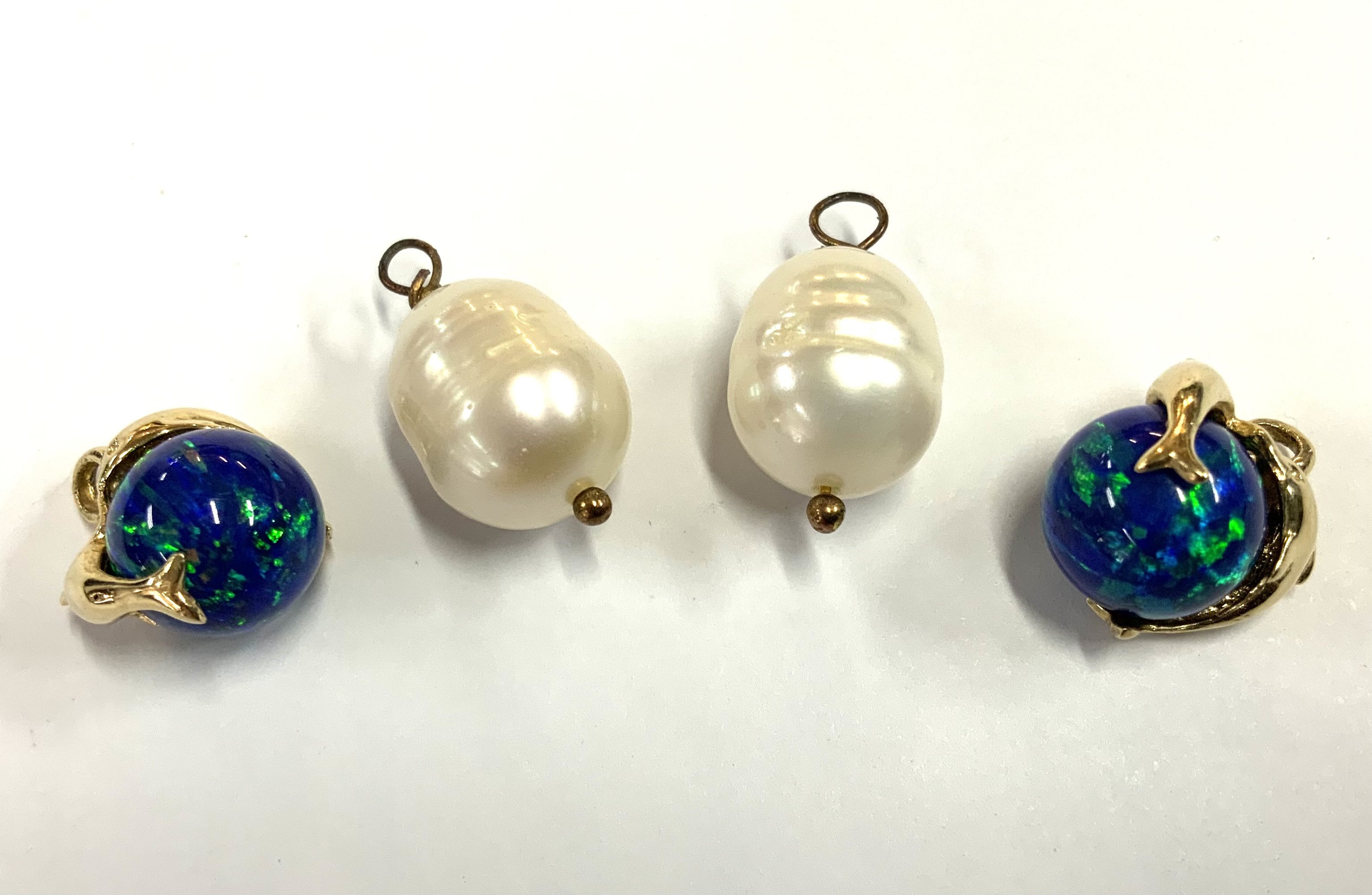2 Baroque pearl pendants together with 2 14ct yellow gold and polished black opal beads (A)