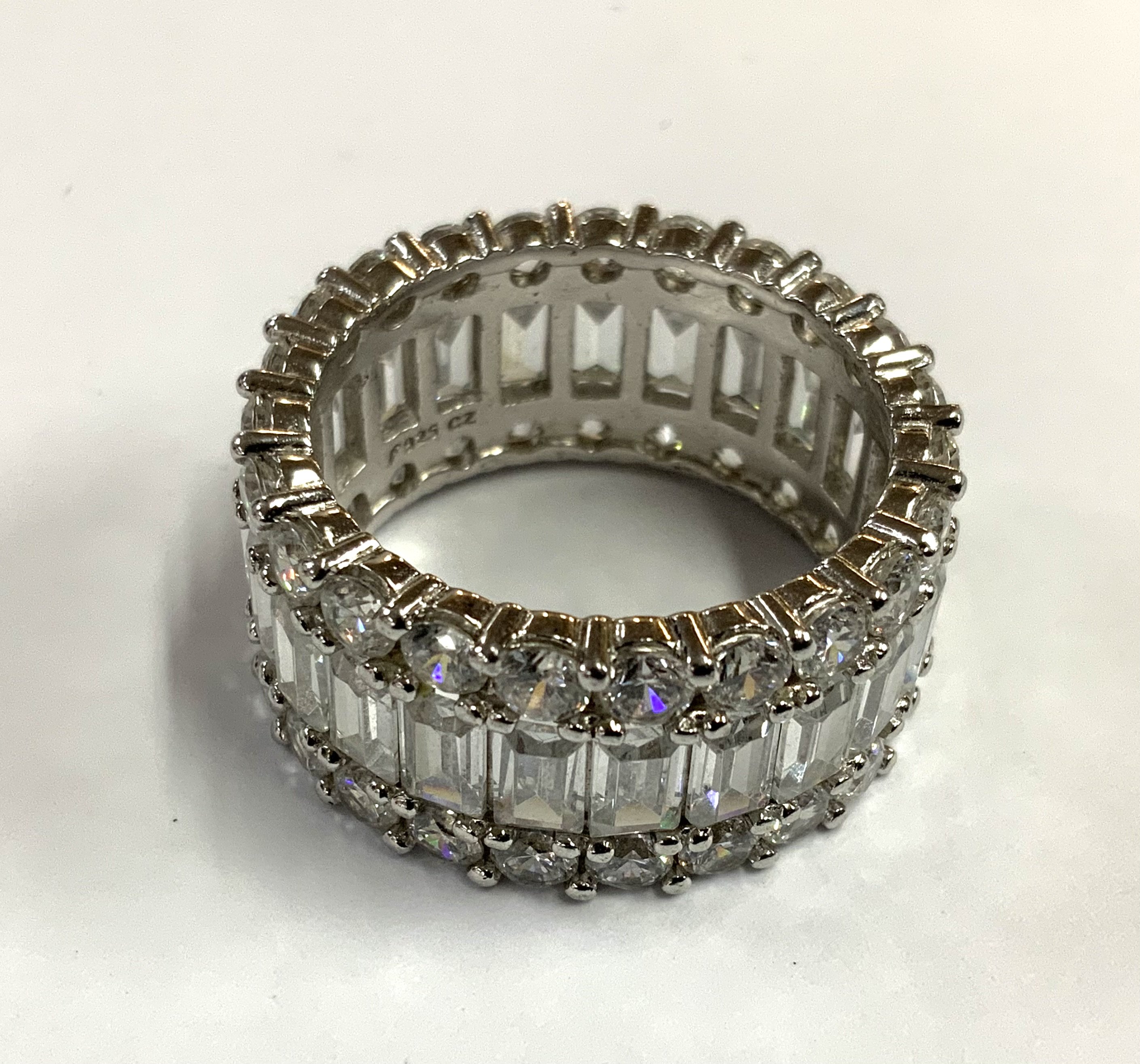 A steering silver and CZ eternity ring. Size S. (A)
