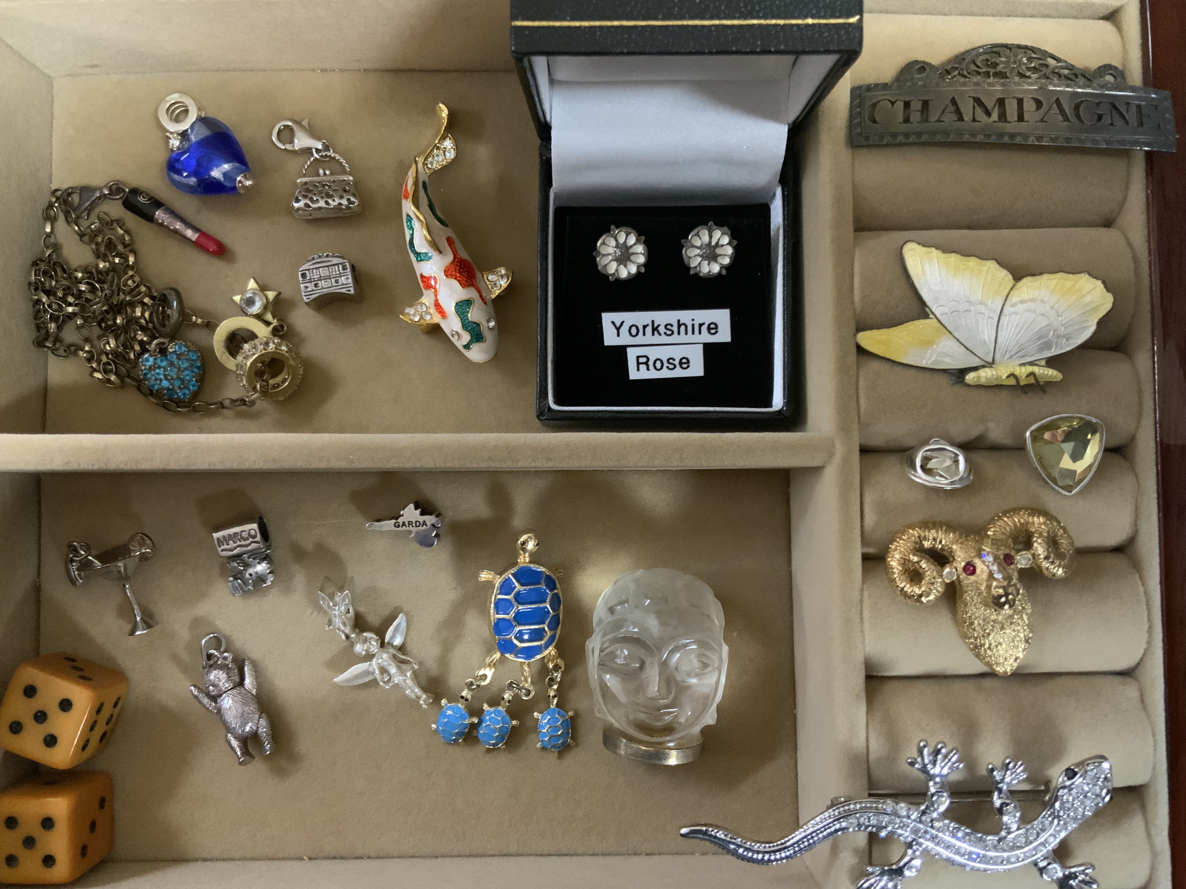 A small collection of brooches and charms etc.(B)