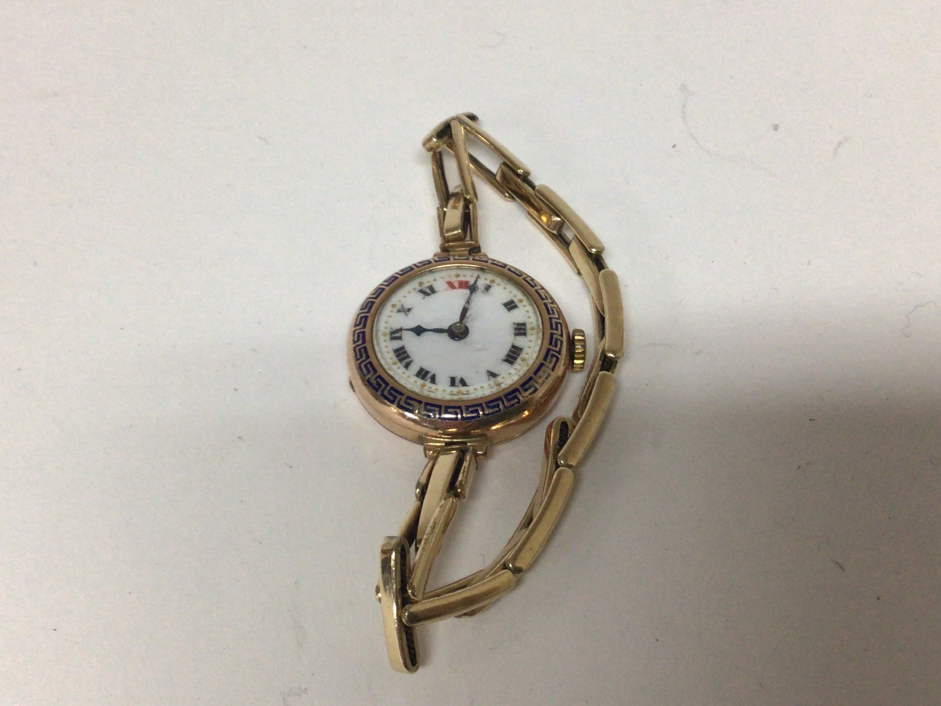 A Vintage 9carat gold ladies watch with an expanding Rolled Gold strap bracelet not seen working