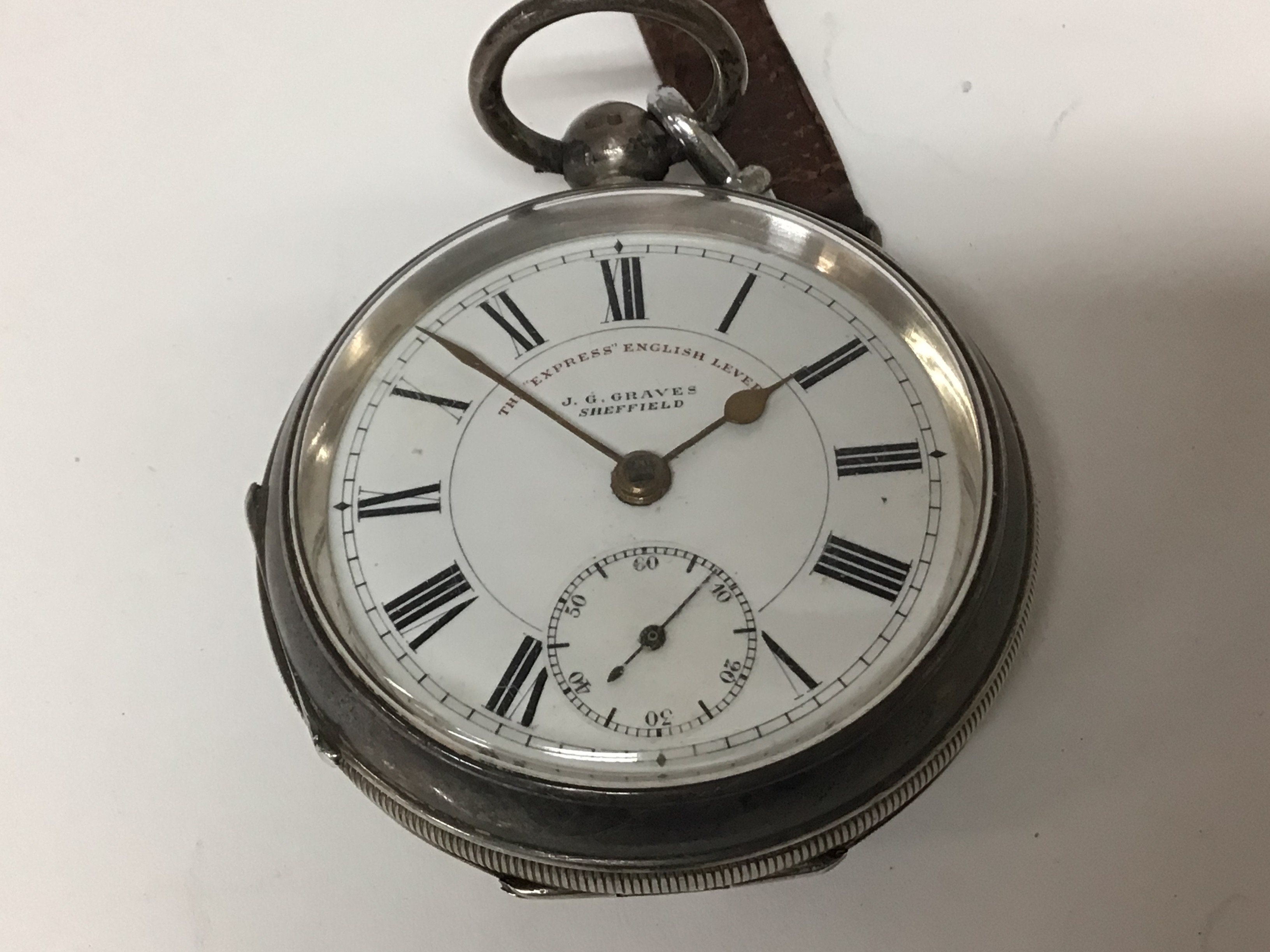 A silver cased Key wind pocket watch The Express English Lever J Graves Sheffield. Seen working.