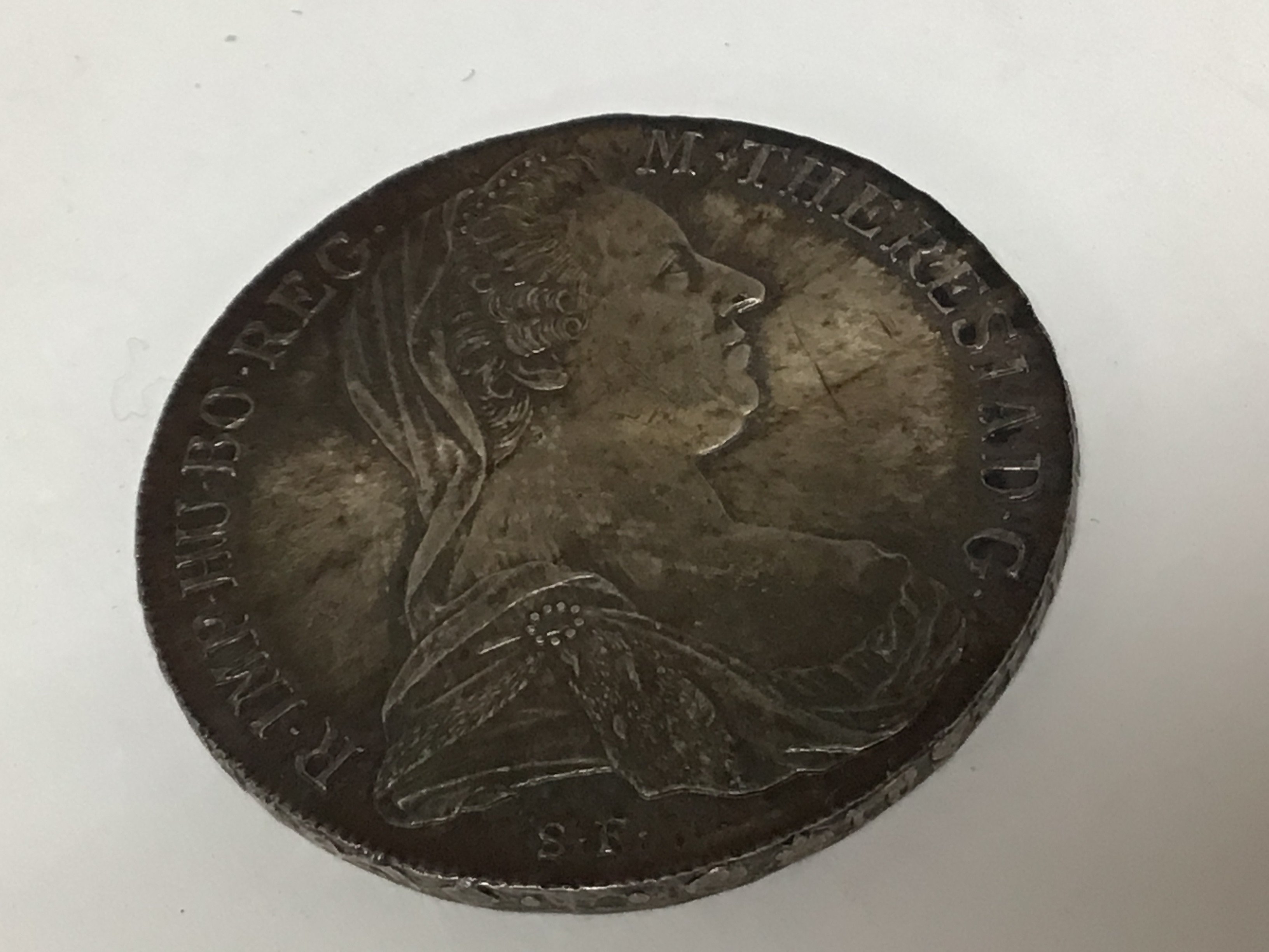 A silver Austrian 1780 Theresa Maria SF coin.