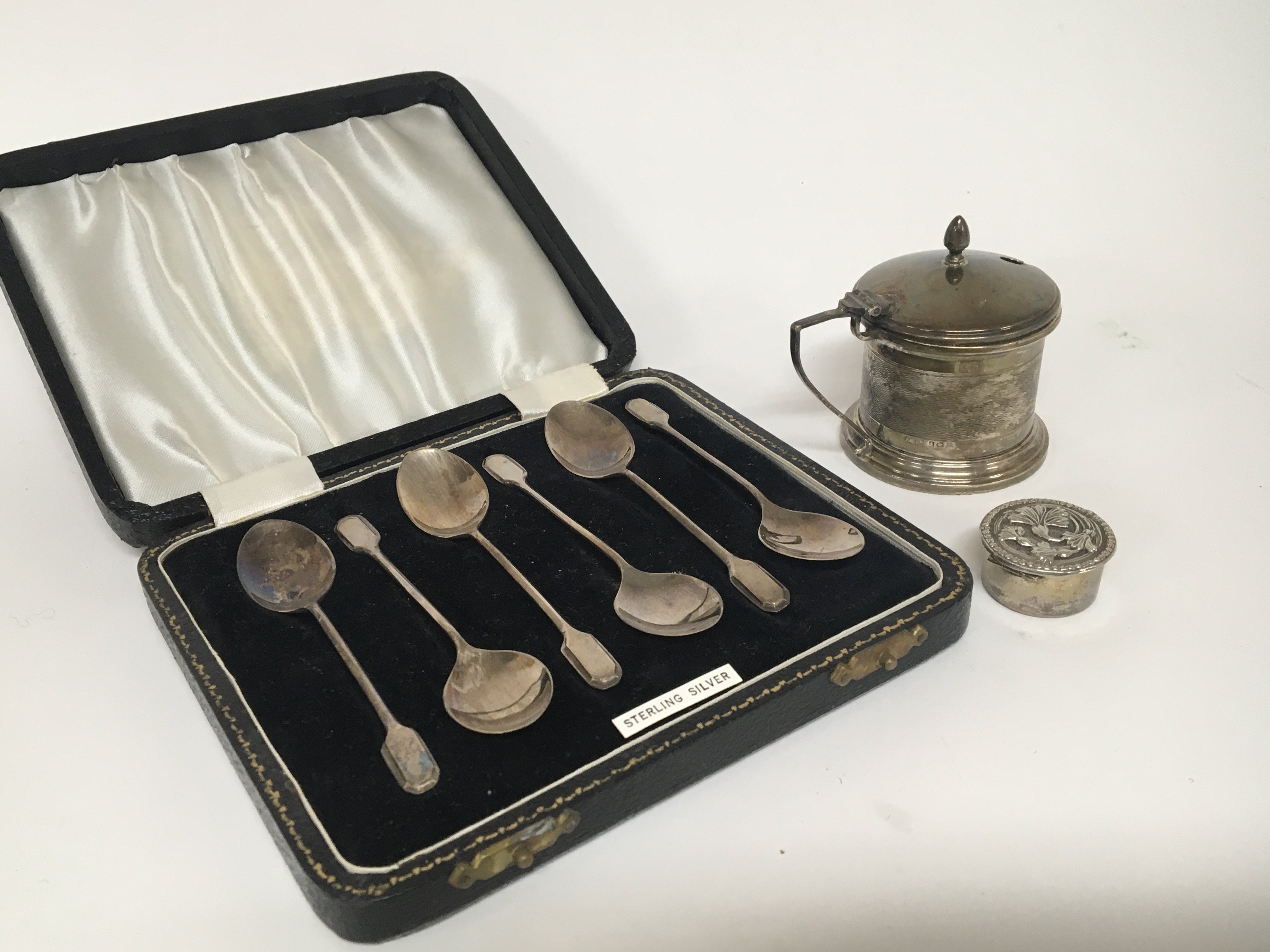 A cased set of silver spoons a silver mustard pot and a small silver box (3)
