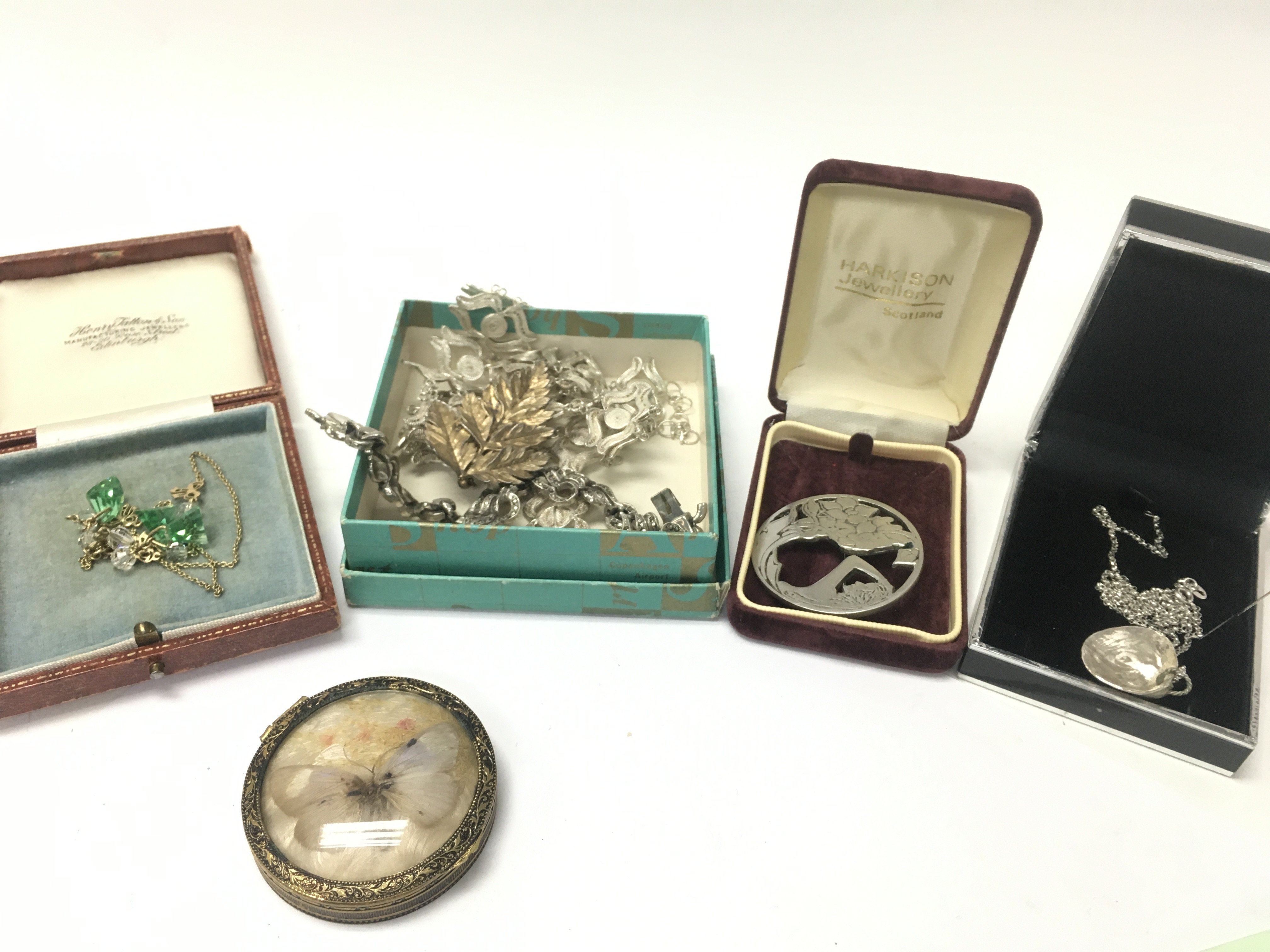 WITHDRAWN - A Collection of jewellery including a butterfly incased compact, rolled gold necklace, Marcasite necklace, Silver Denmark leaf brooch, silver necklace with shell pendant etc. postage cat B