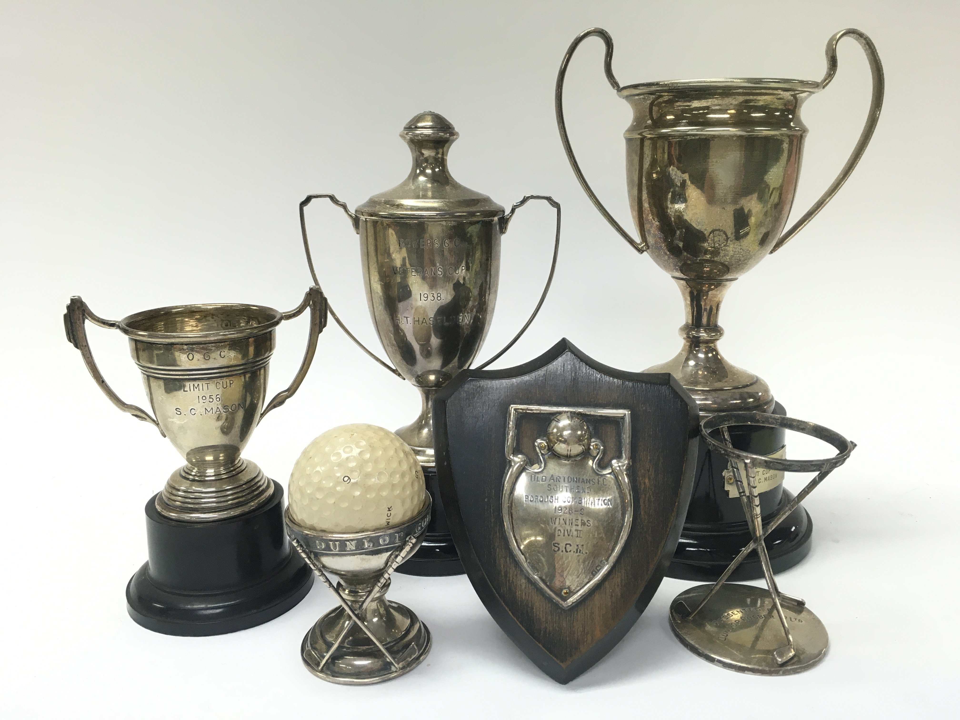 A Collection of silver hallmarked trophies. 5 to 20cm tall approximately. Postage category B