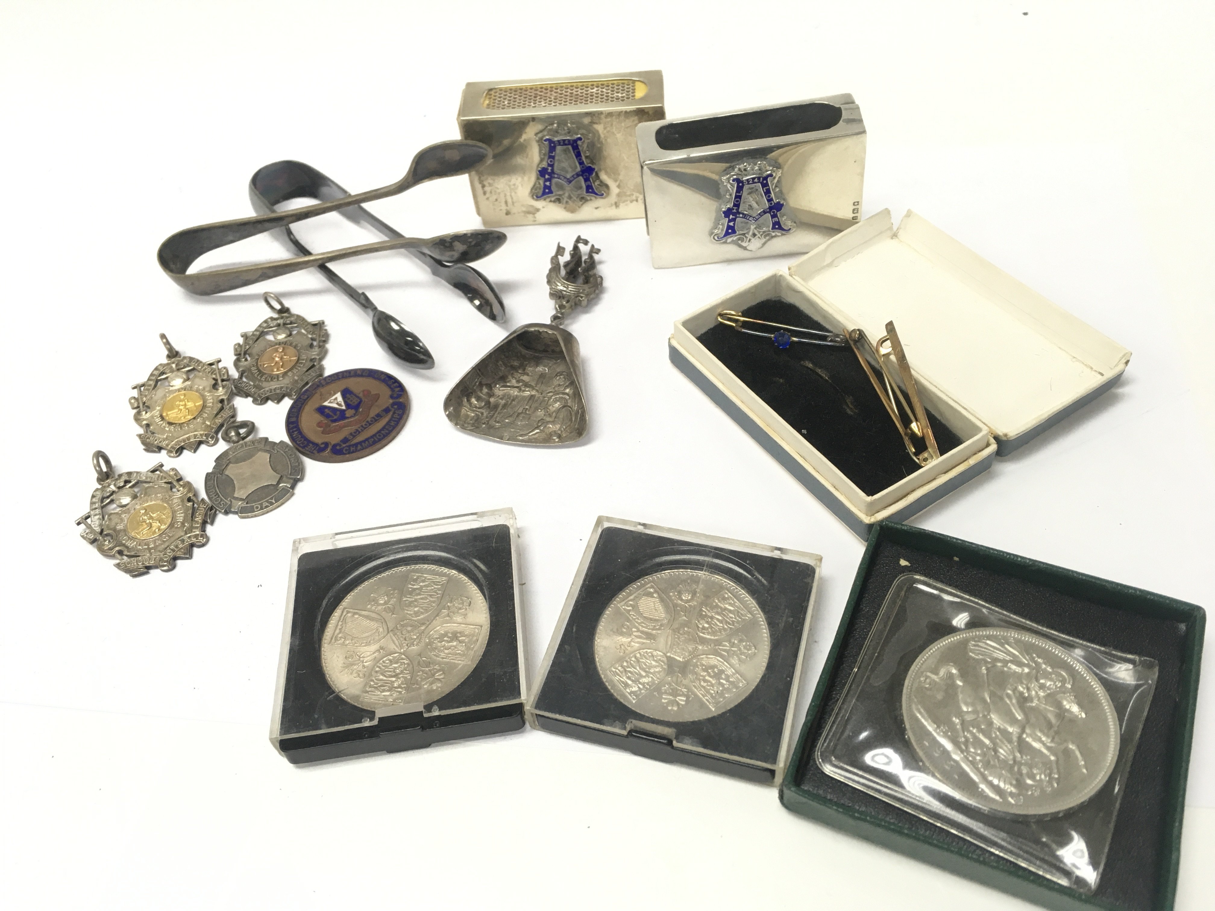 A Collection of silver hallmarked Southend and district football medals from circa 1920, free masons silver hallmarked match box holders and other assorted items. Postage category B