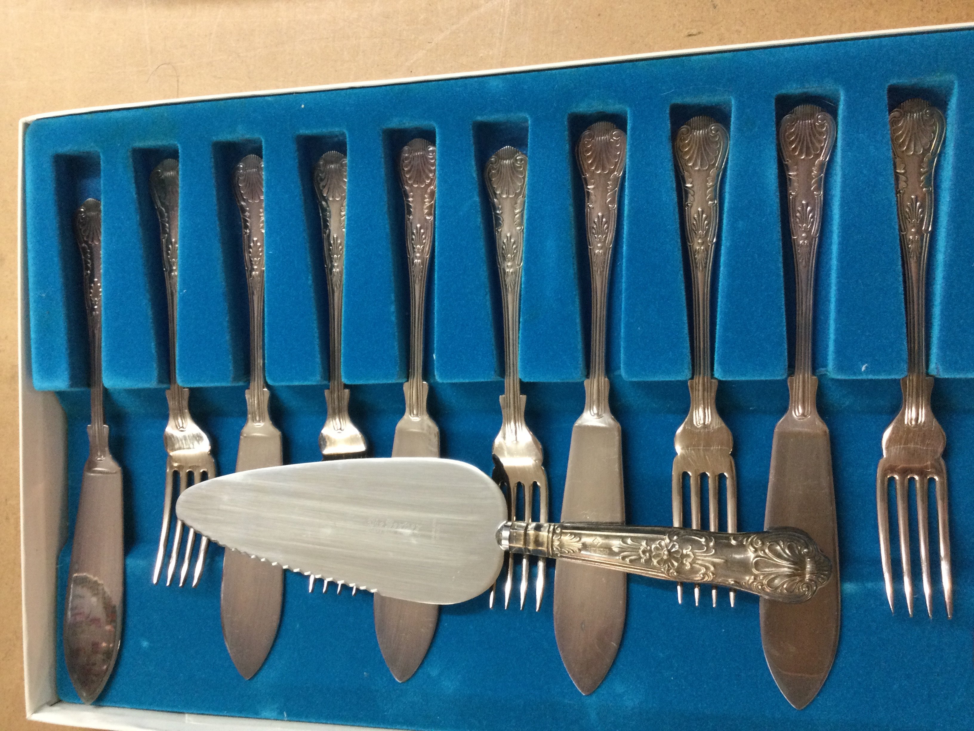 A cased canteen of kings cutlery and one other cutlery set .
