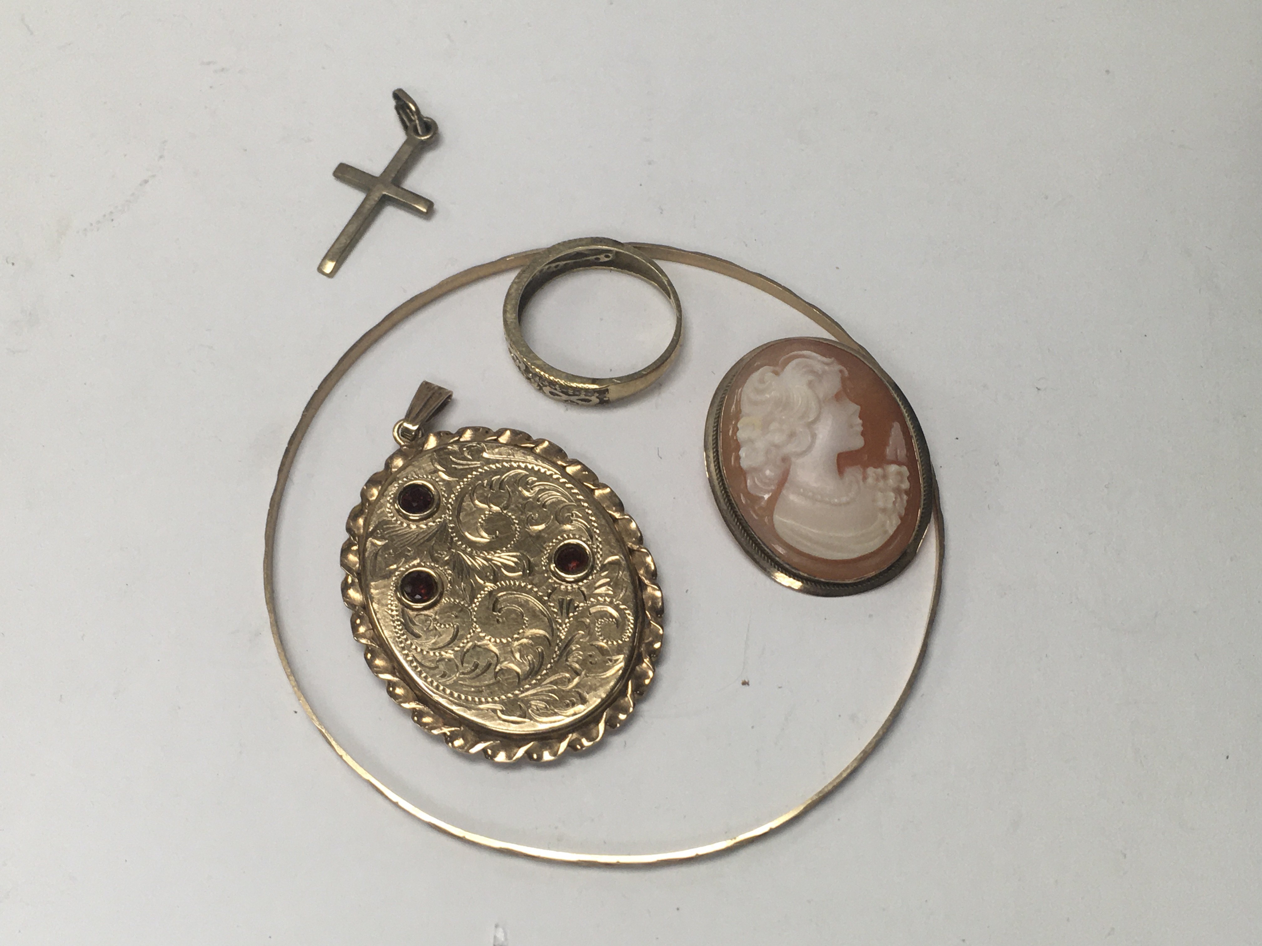 A 9 ct gold backed pendant together with a cameo, bangle, ring and small cross pendant.