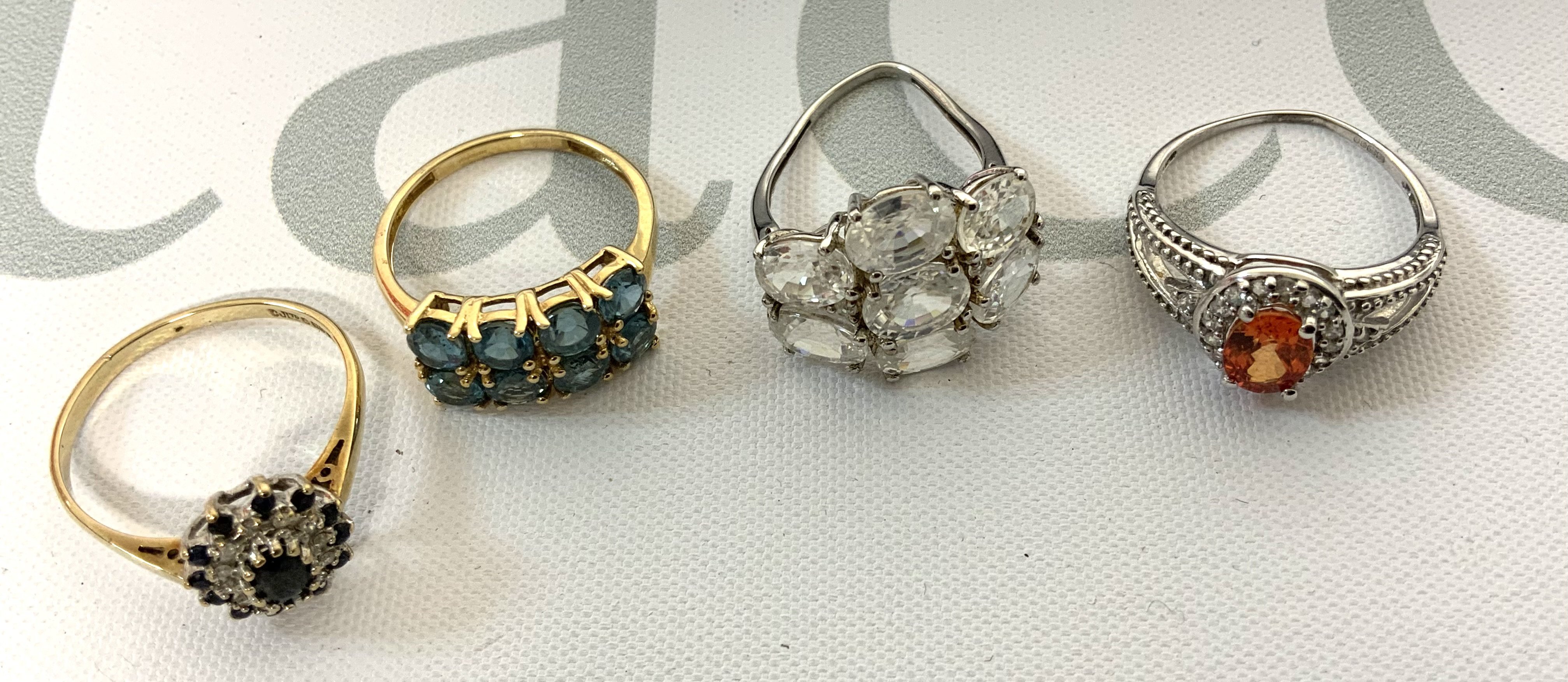 4 9ct gold and semi precious stone set rings. (A) total weight 11g.