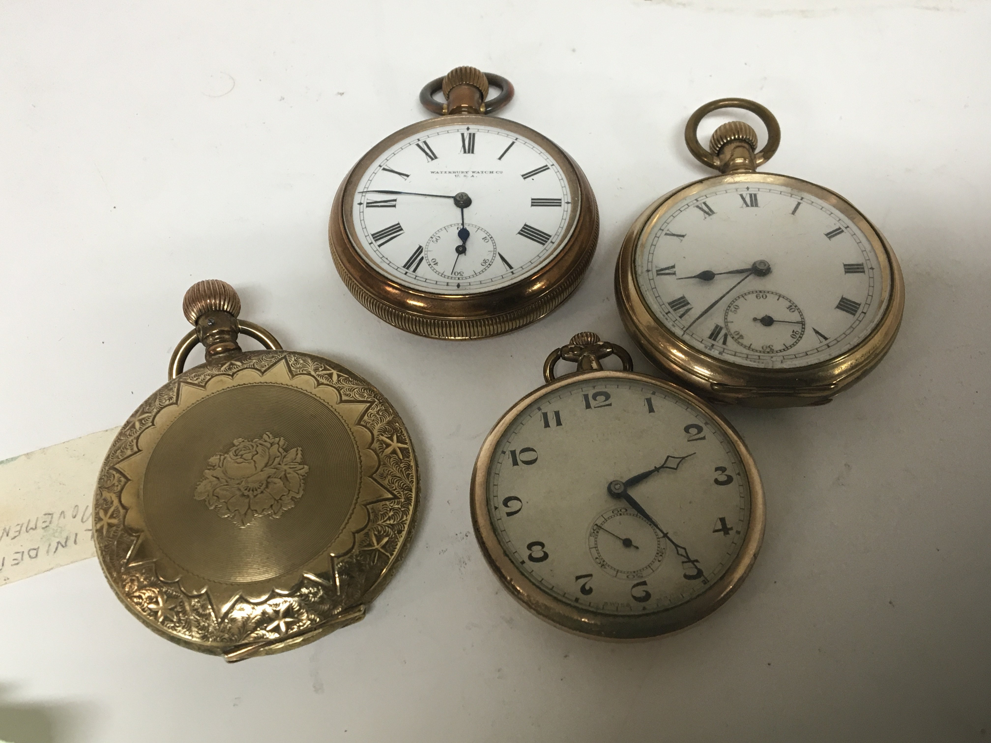 Four gold plated and metal cased pocket watches including a Hunter pocket watch.