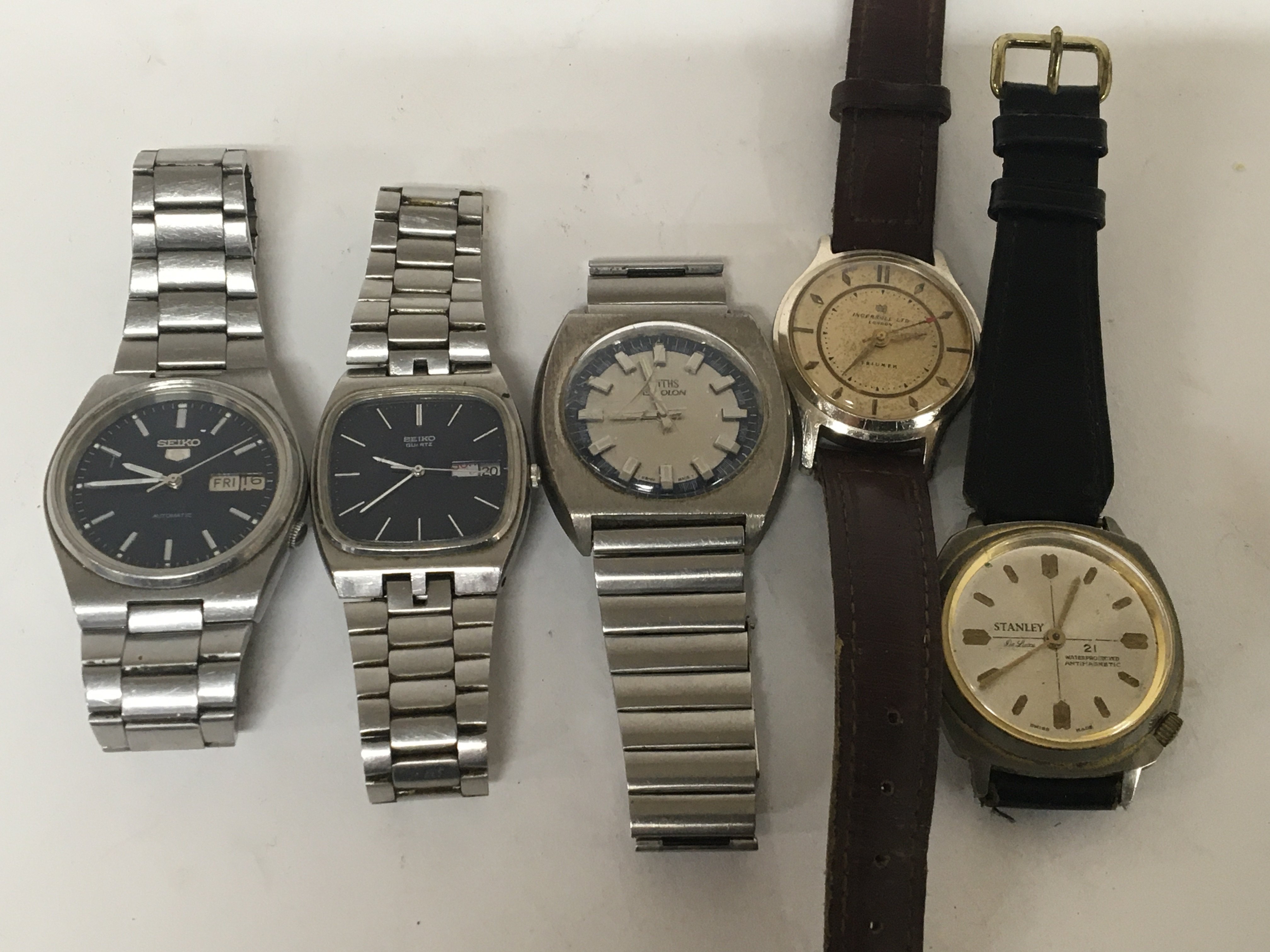 Five Vintage gents pocket watches the Seiko 5 day date Automatic seen working.