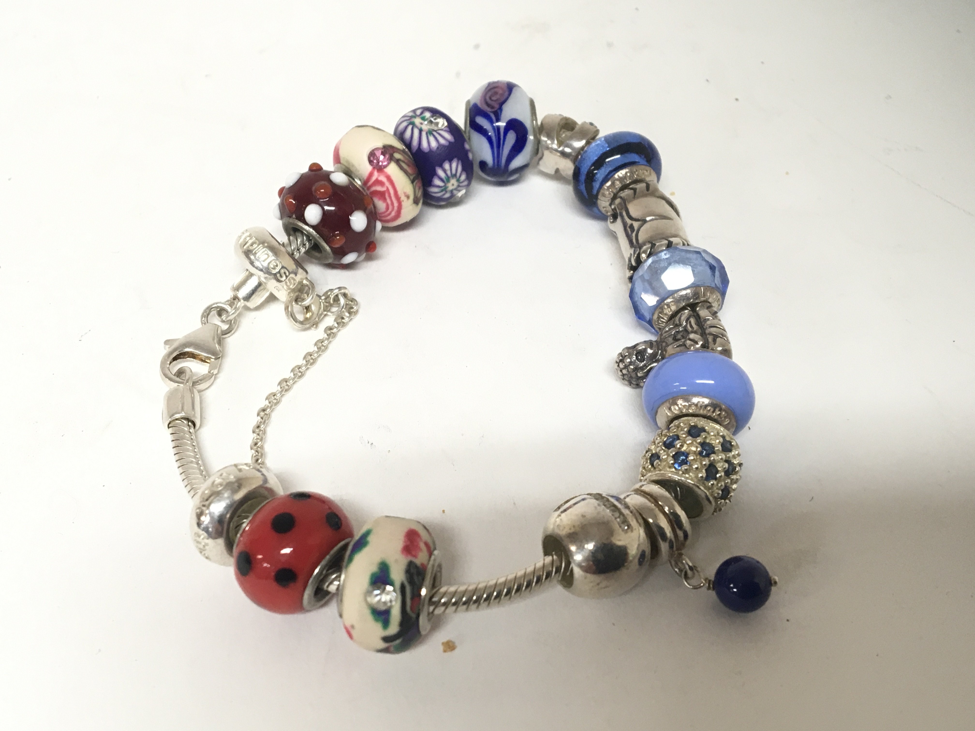 A Links of London silver bracelet with coloured beads.