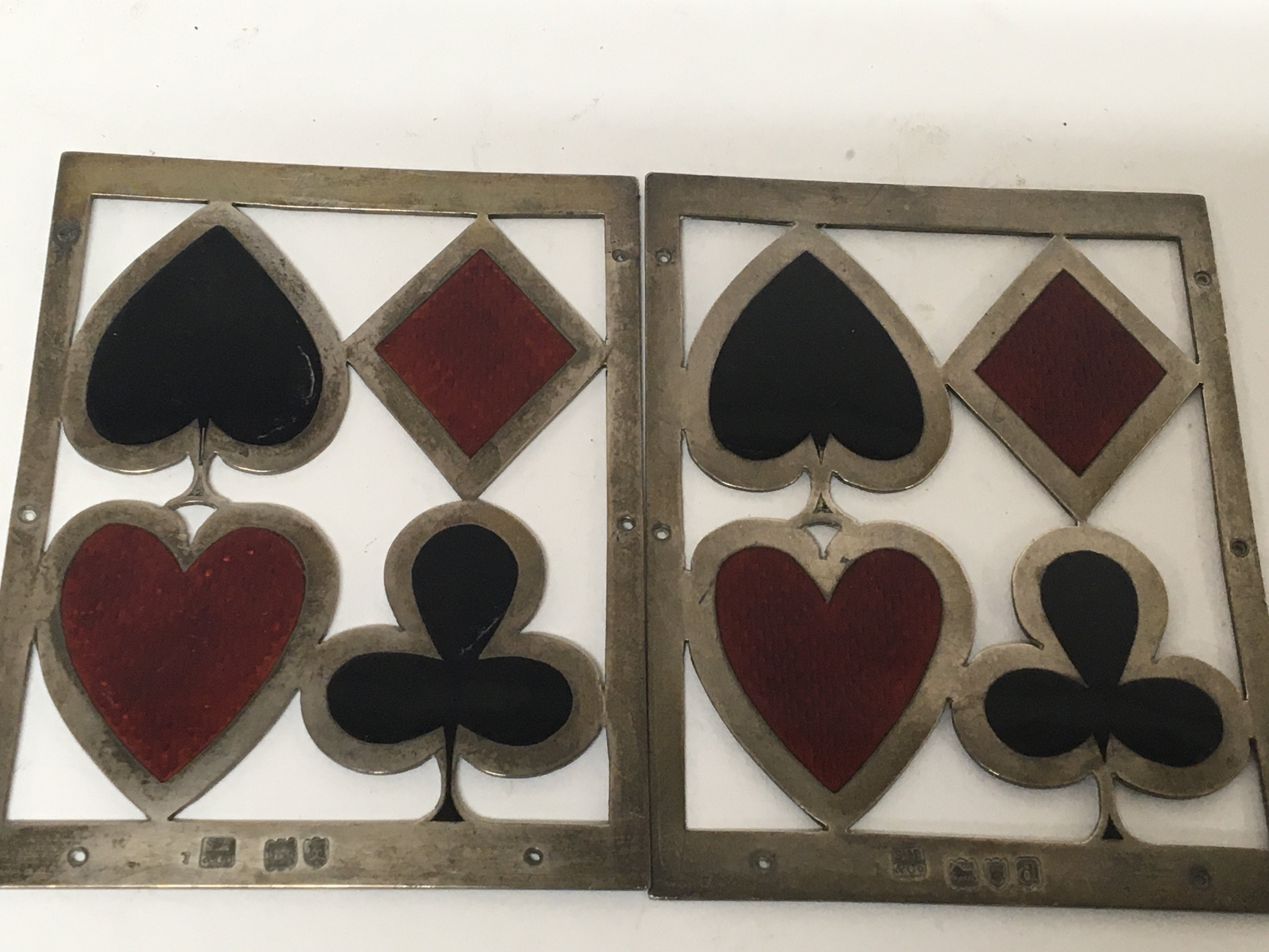 A pair of silver and enamel playing card box mounts London hallmarks maker SM&Co slight damage to enamel. 9.7cm x 7.5cm