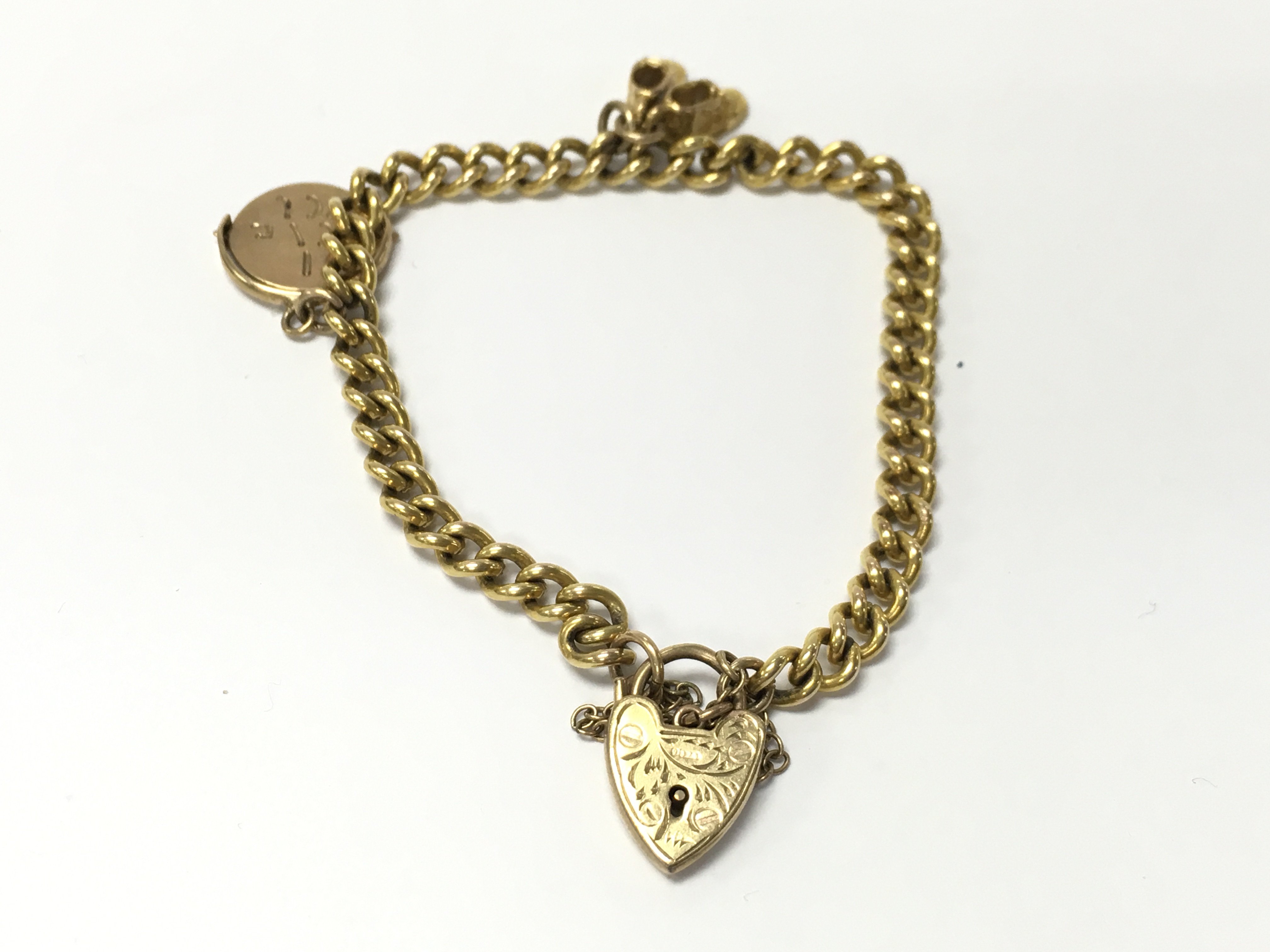 A 9ct gold charm bracelet with charms. 13.28g Postage A