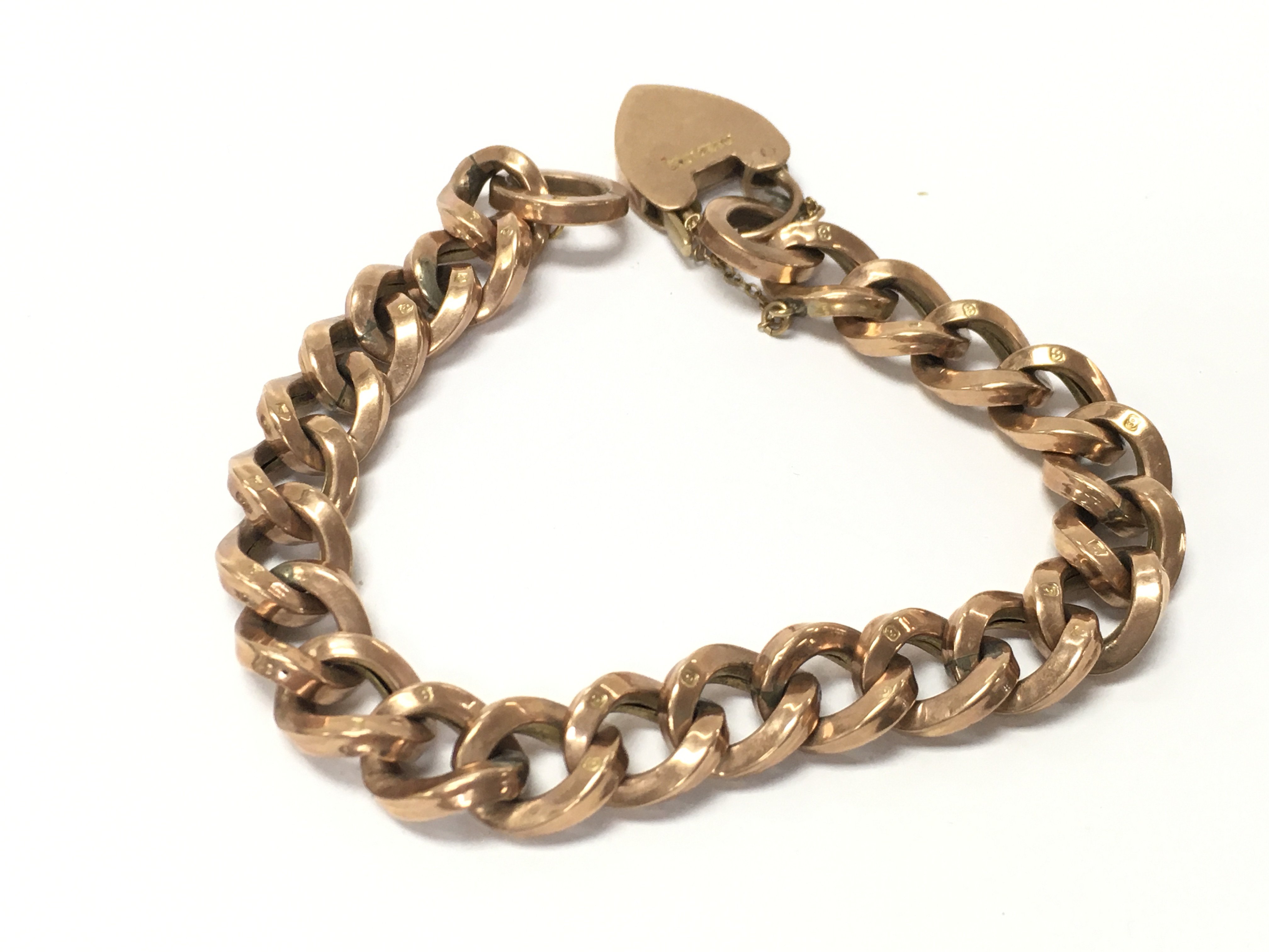 A 9ct rose gold bracelet with open links. 17.02g Postage A