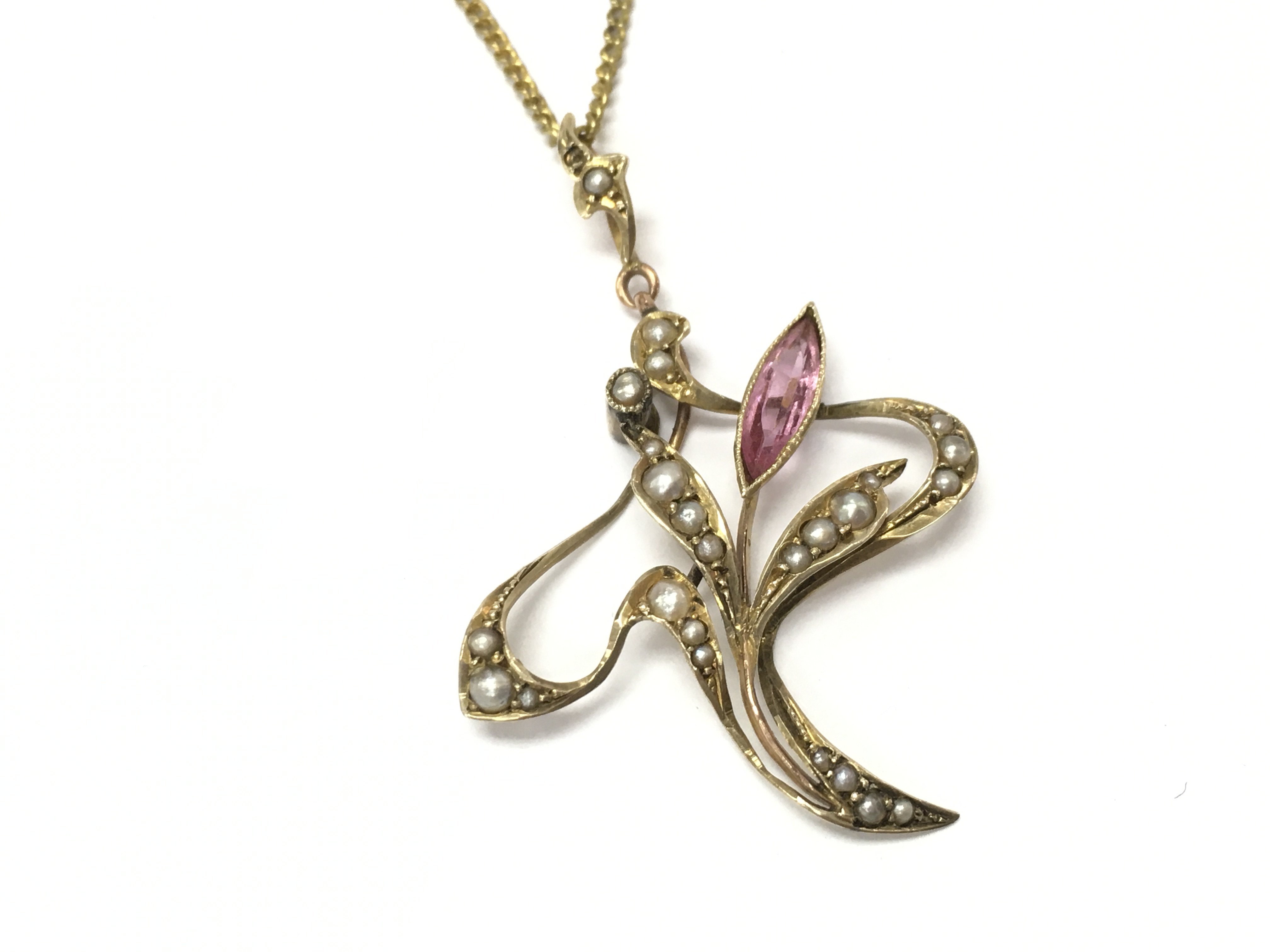 A 9ct gold brooch set with seed pearls. Postage A