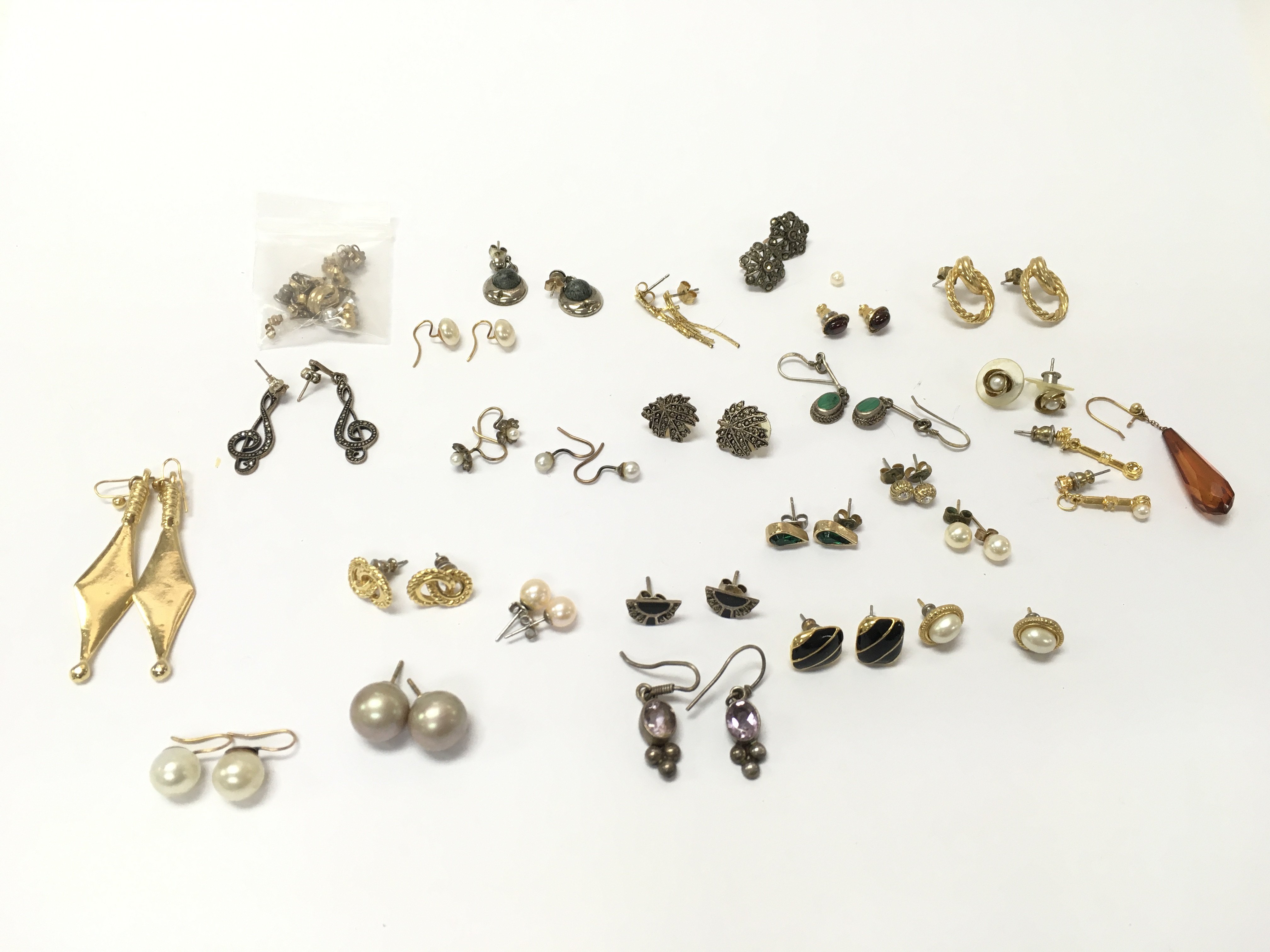 A collection of assorted earrings. Postage A