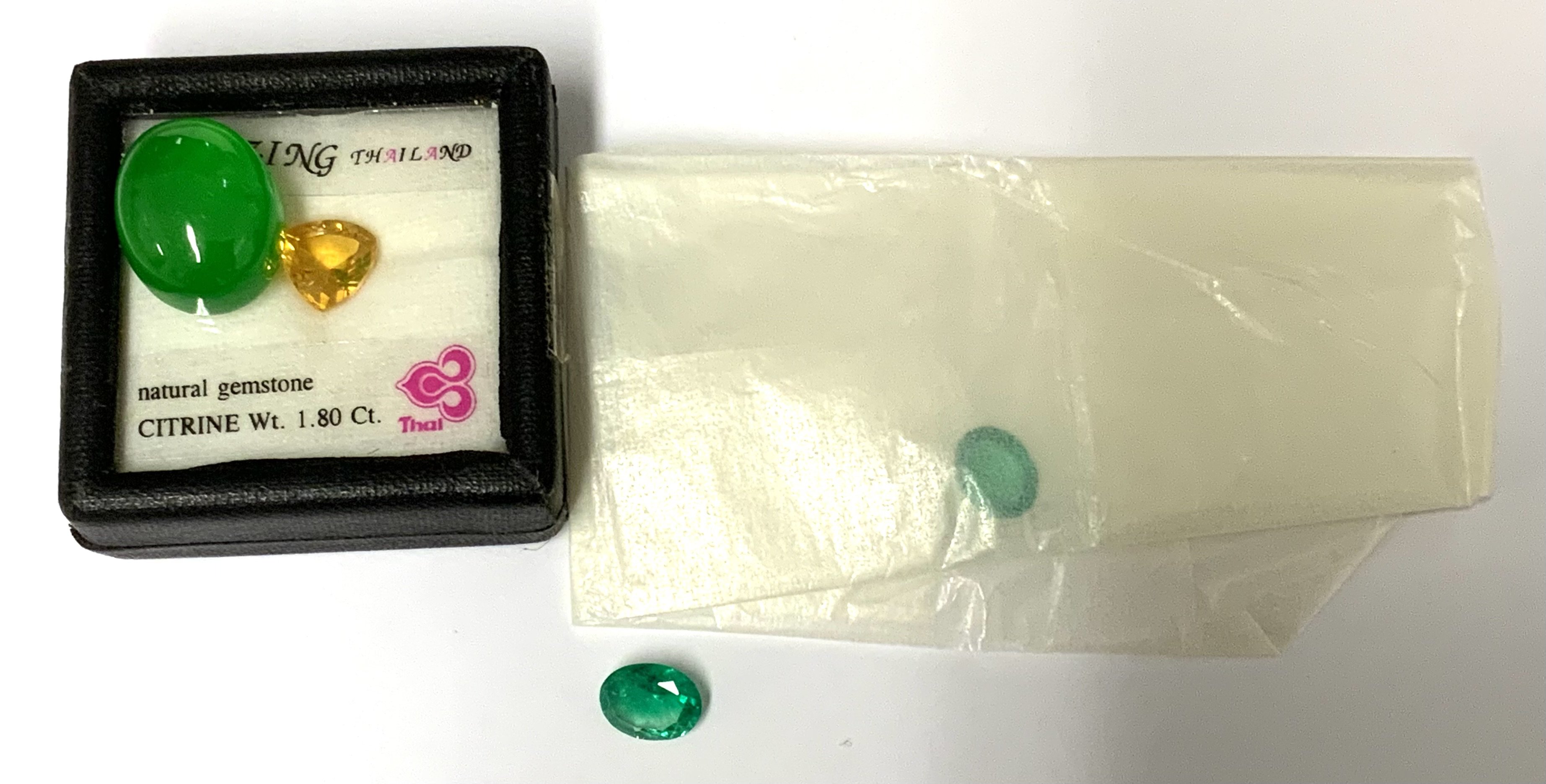 Loose stones. 1.41ct oval cut emerald, 1.36 oval cut emerald, 1.8ct citrine, cabochon green jadeite (A)