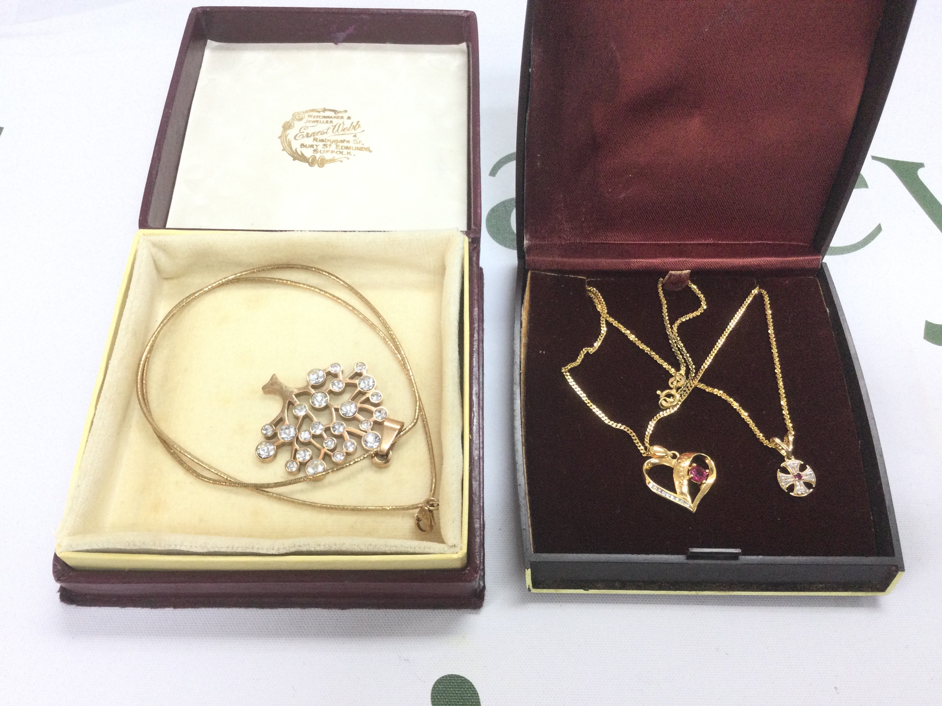 A silver gilt 'tree of life' pendant on chain silver gilt heart pendant and one other. Shipping category A.