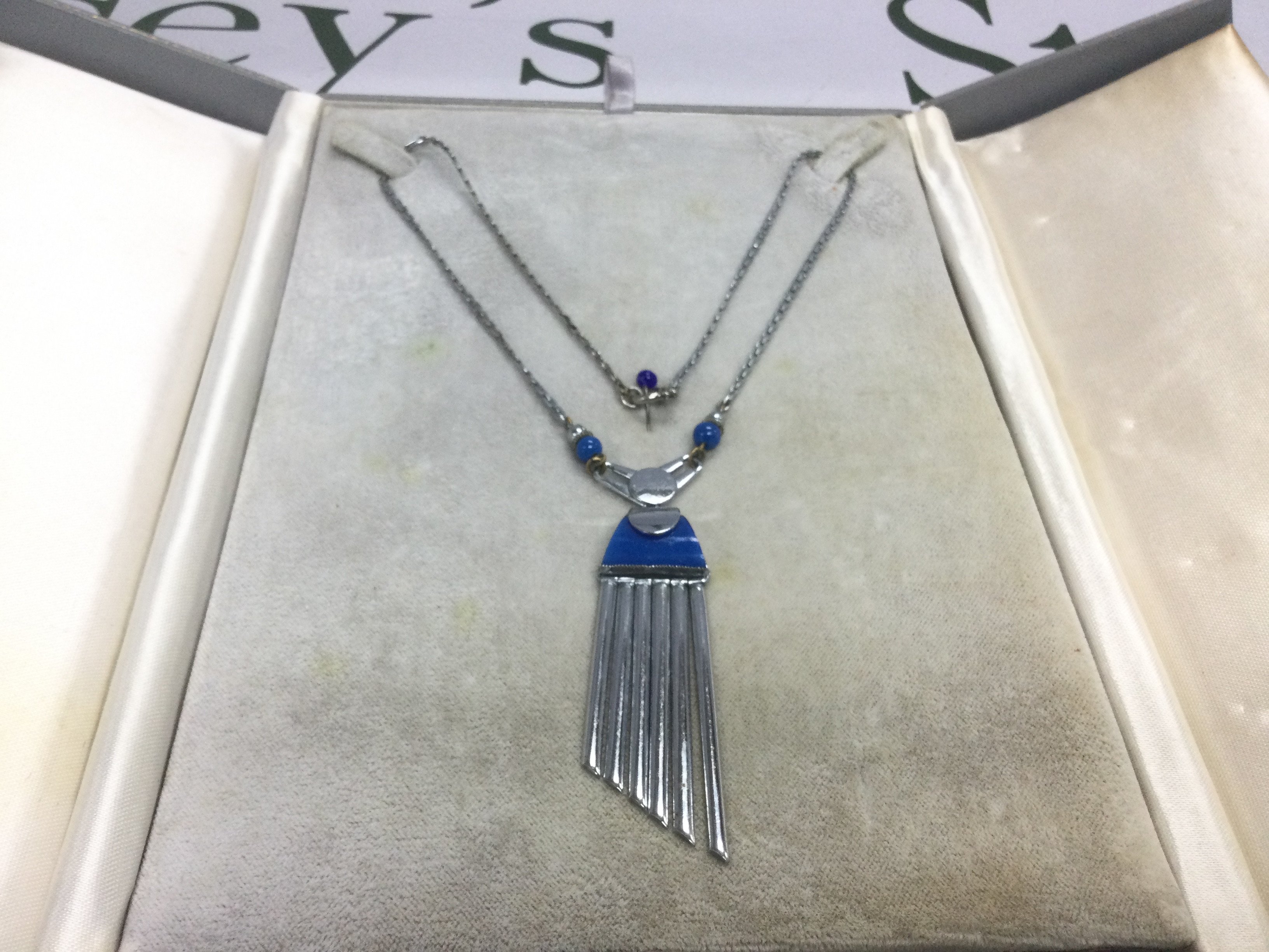 An Art Deco chrome necklace. Shipping category A.