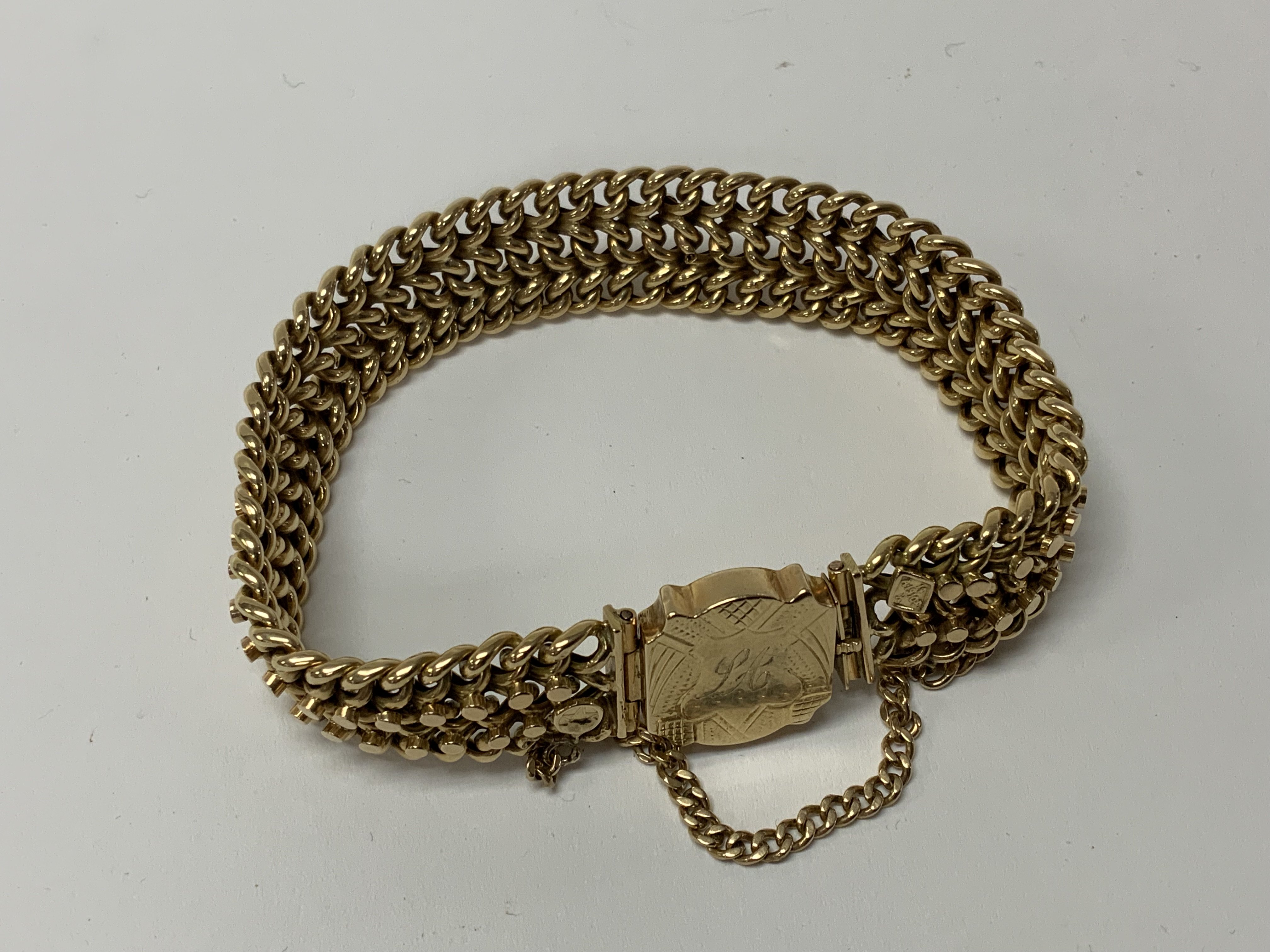 A fine George V 14ct gold bracelet in a Gypsy design, engraved latch/ clasp design, marked with 2 applied lozenges, total weight 27.87g (A)
