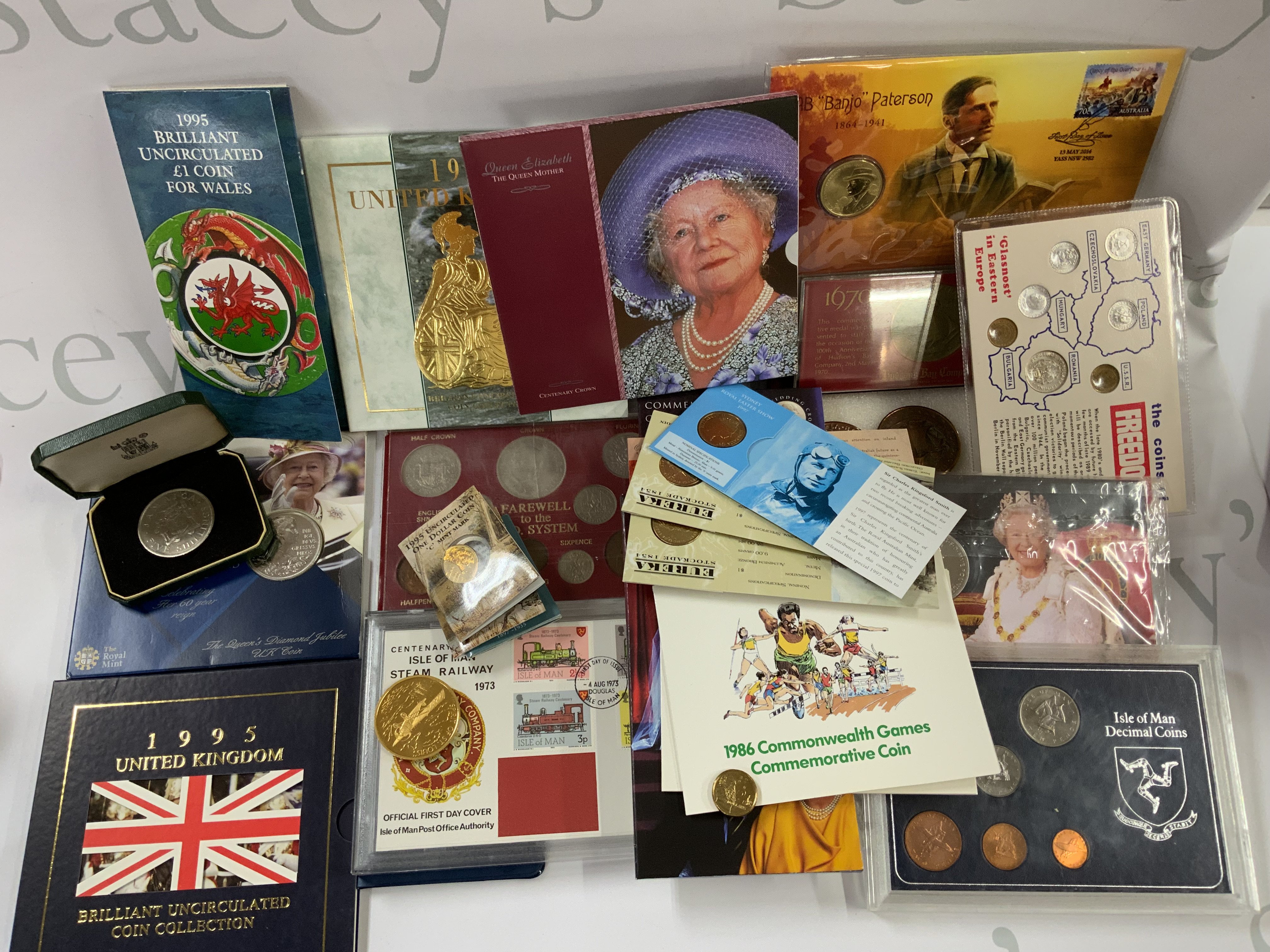 A collection of presentation and commemorative coin sets. (B)