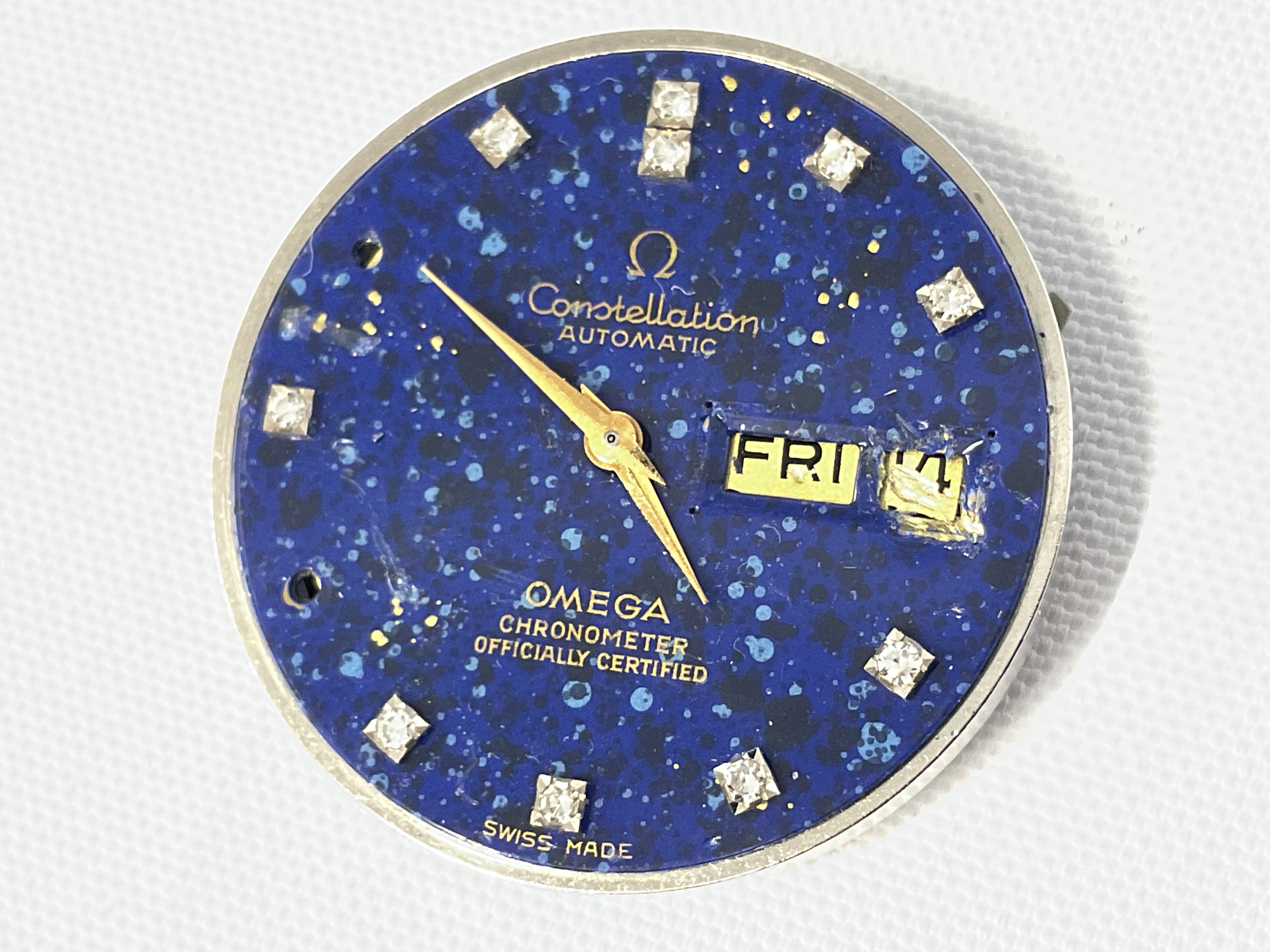 An Omega Star Dust Dial set with diamonds, some stones missing and some damage. Postage category A
