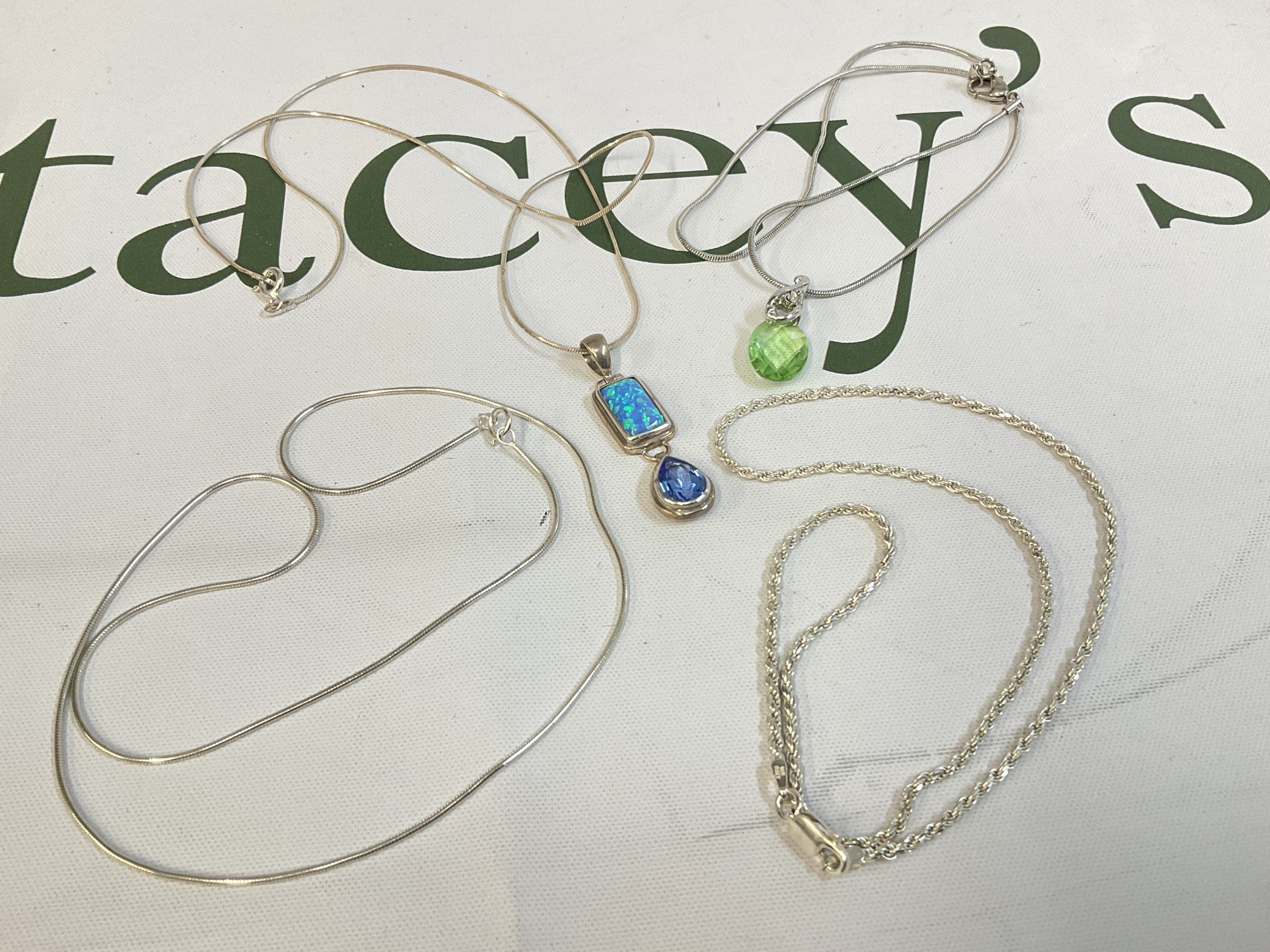 Four silver chains, postage category A