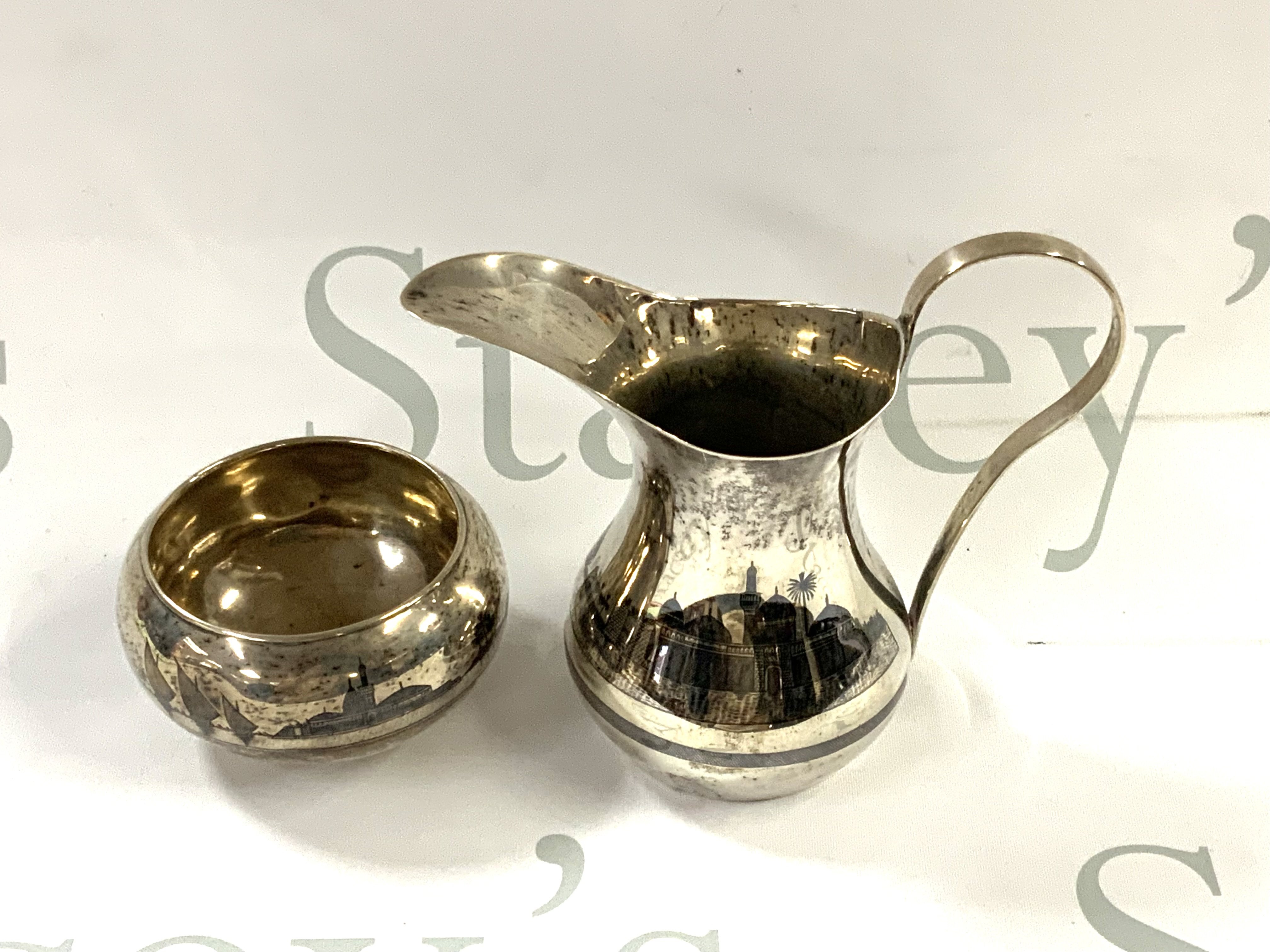 A Niello silver jug and sugar bowl. (A).