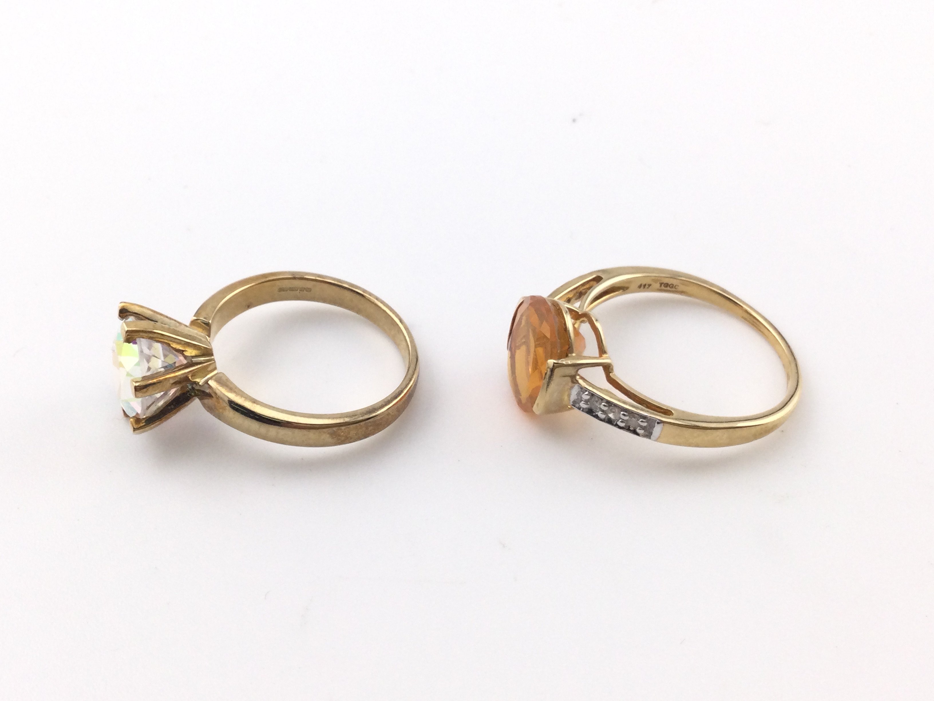 Two 9ct gold rings set with stones. Total weight 7.34g Postage A
