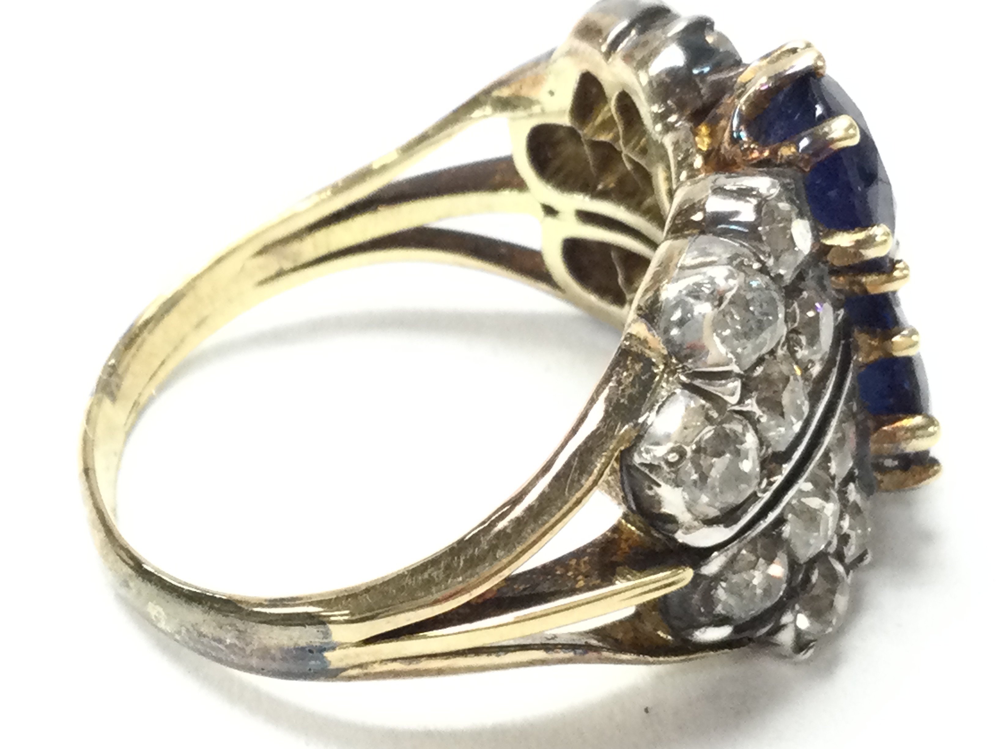 An Unmarked (tested) 18ct gold two stone sapphire and diamond cluster cocktail ring (Mix of Diamonds and Moissonite) (A).