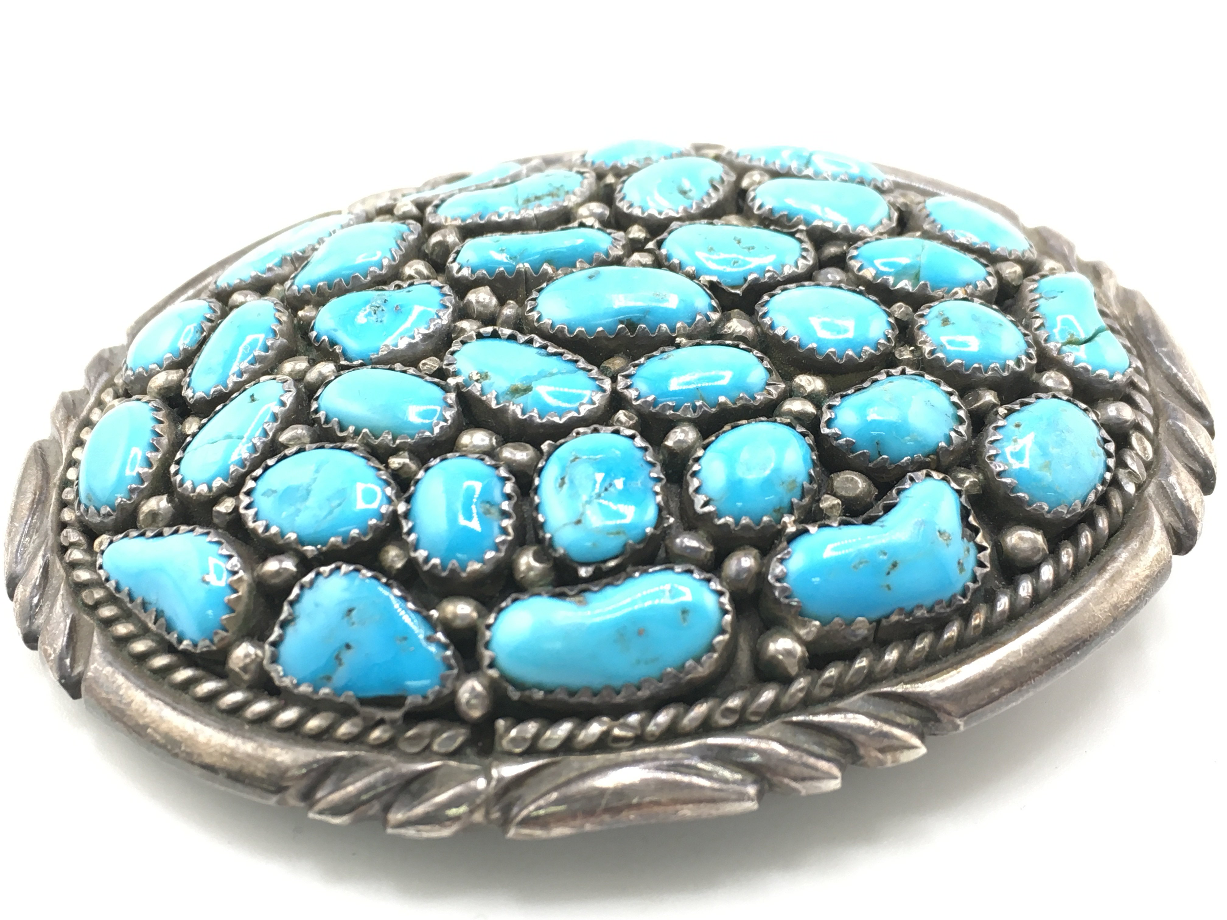 A vintage mens sterling silver and turquoise belt buckle. Approximately 8cm wide and 55.34g. Postage B