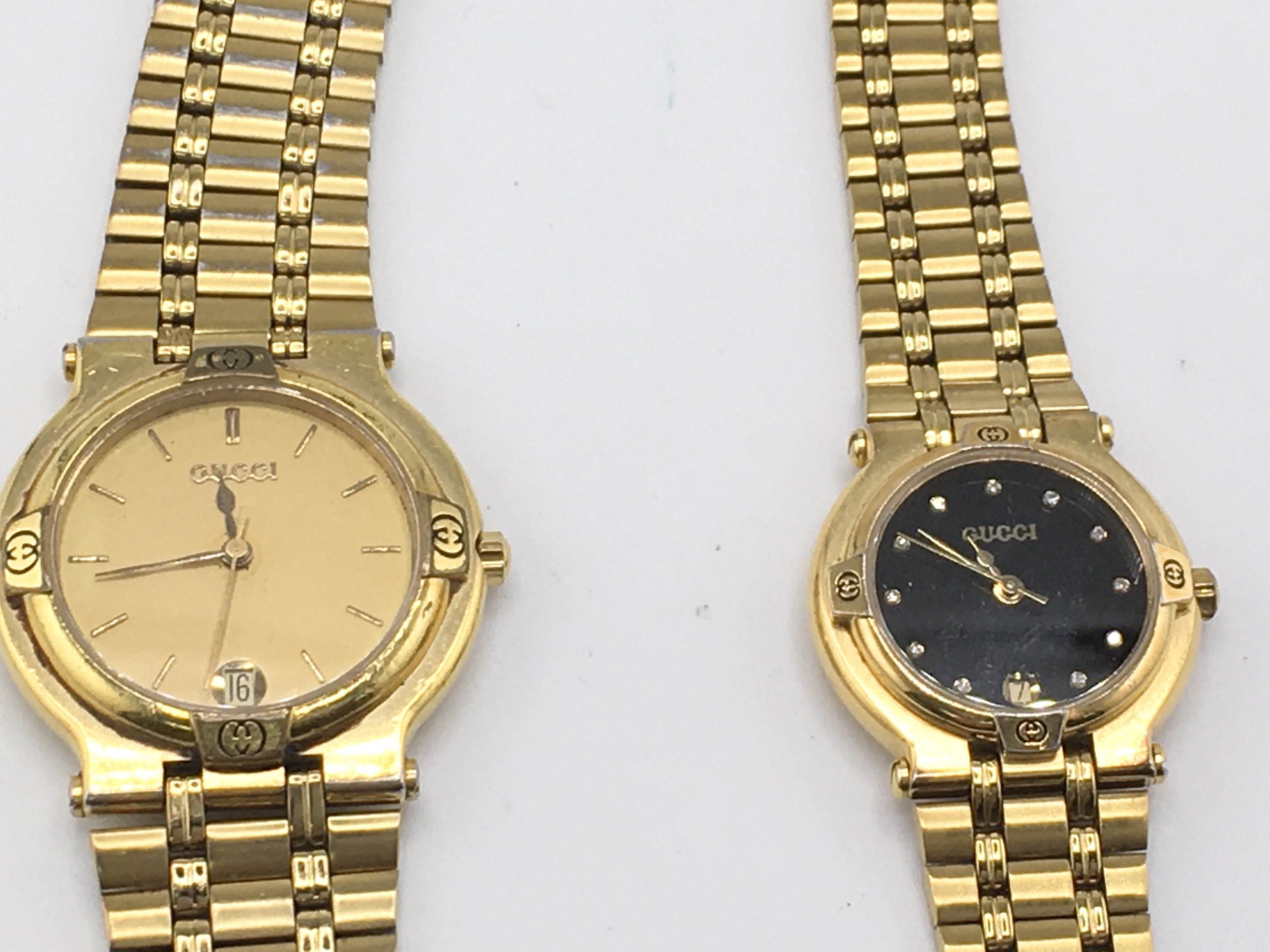 A his and hers gold plated Gucci watches. Postage B