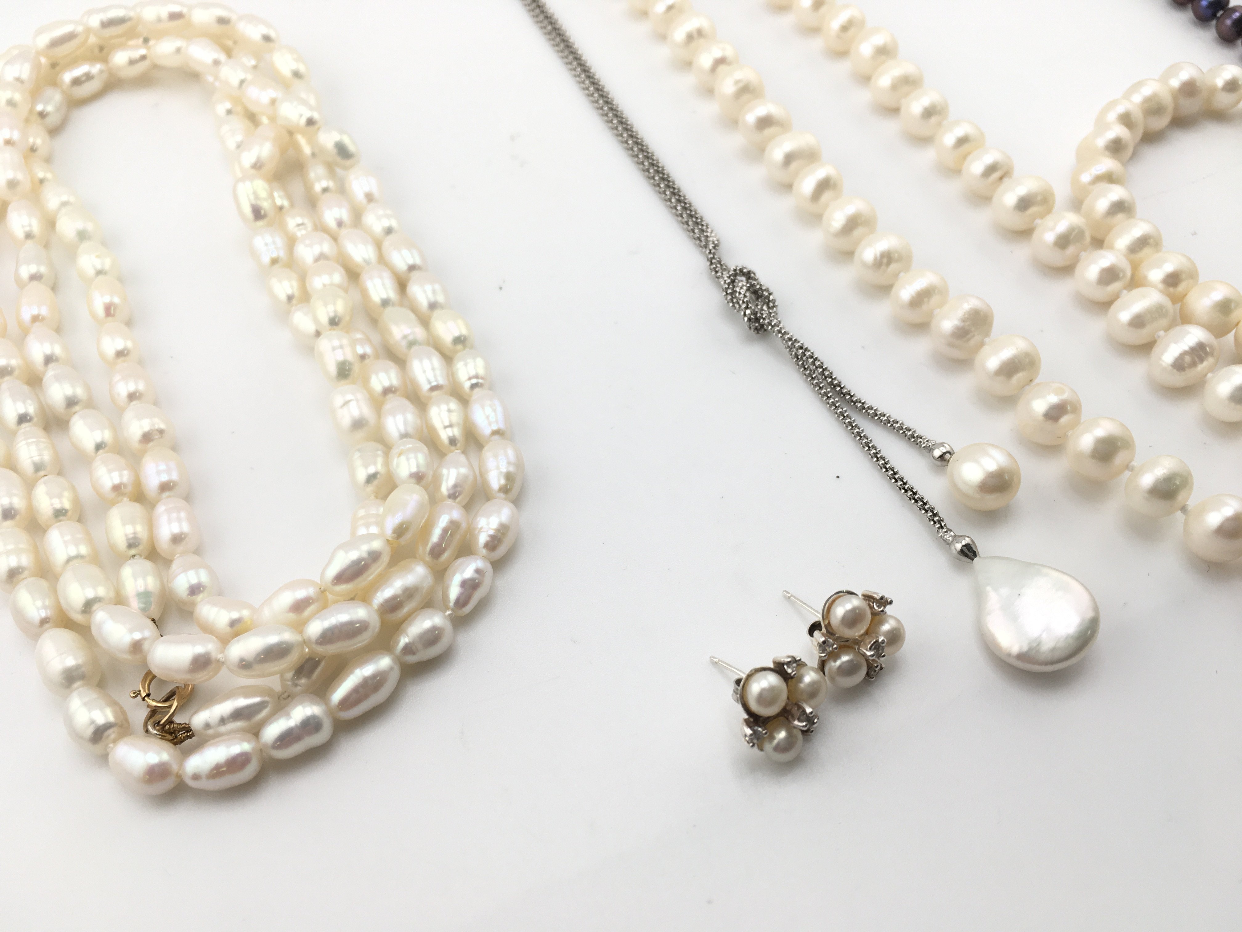 A collection of assorted pearl jewellery items including necklaces and earrings etc Postage B
