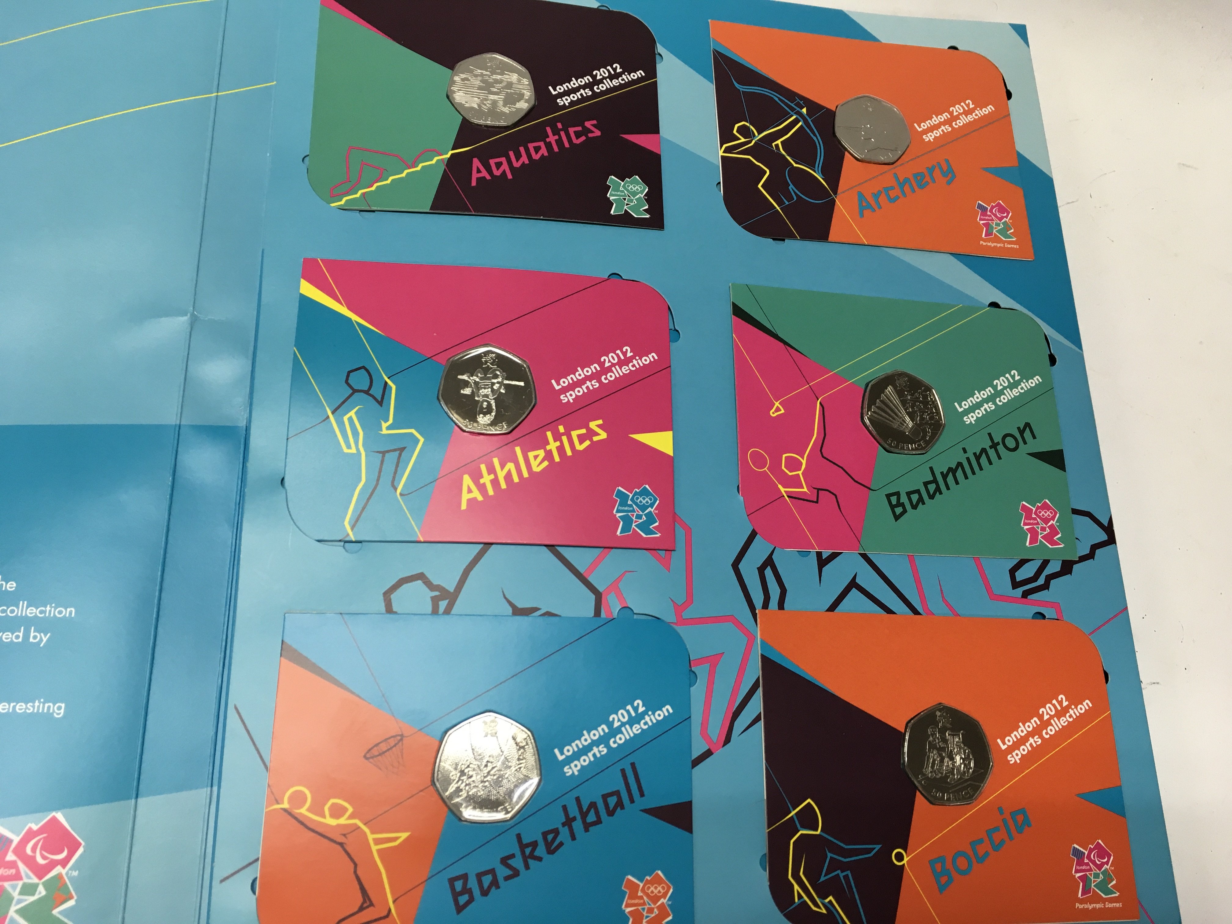 A complete london 2012 Olympic 50p collection including completer medal. Postage B