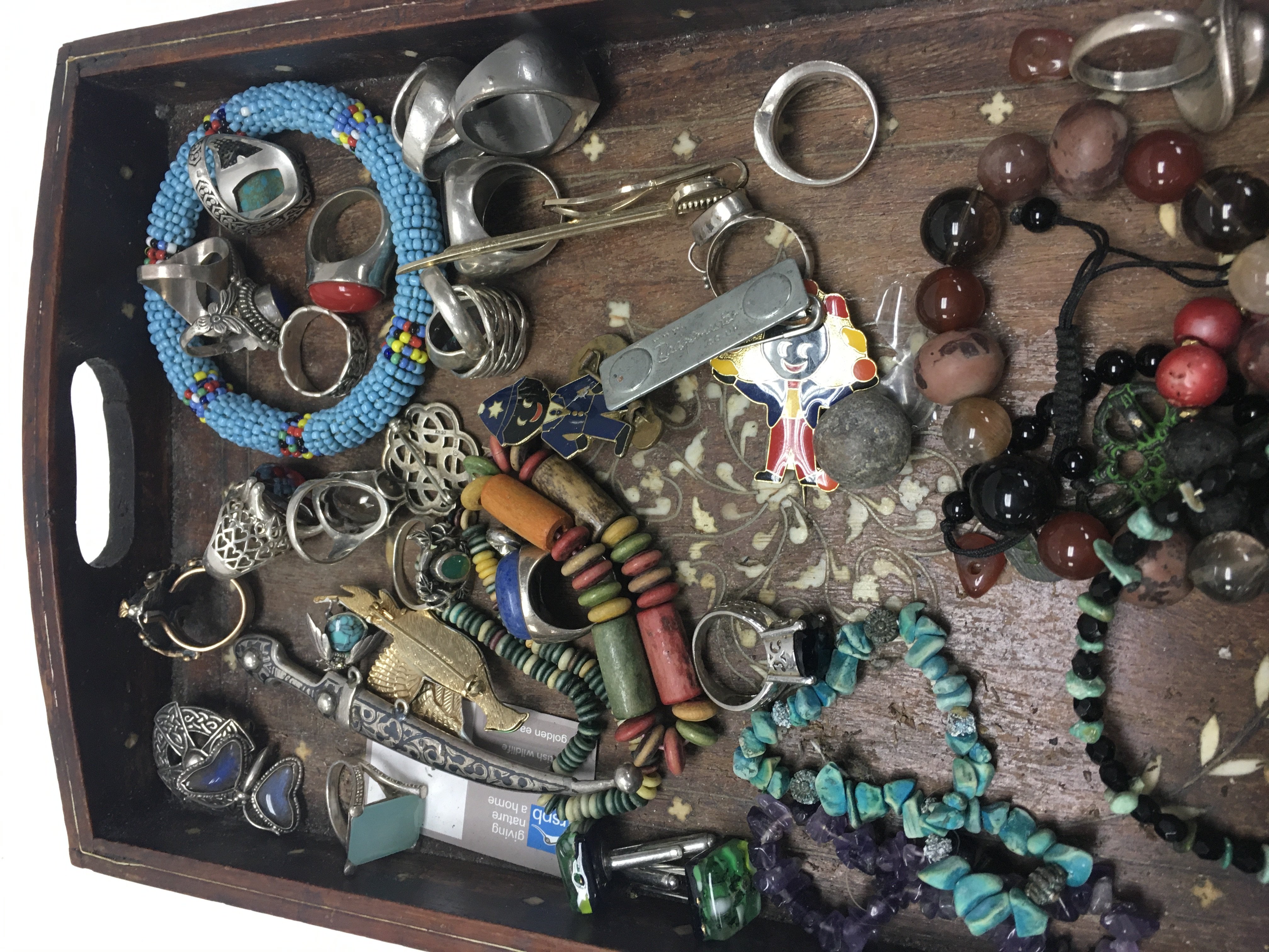 A collection of silver rings and various costume jewellery.