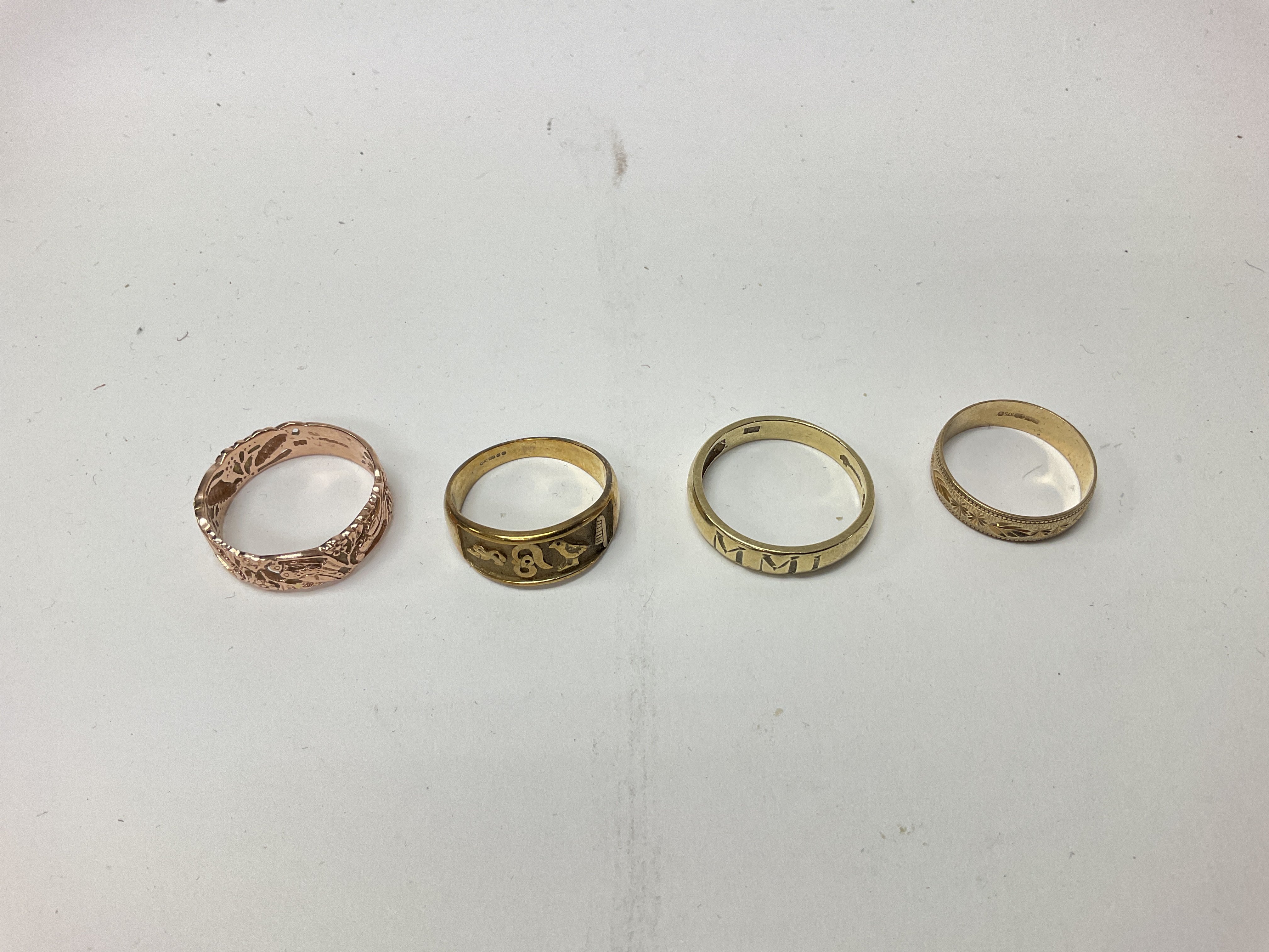 Four 9ct gold bands, approx weight 13 grams.