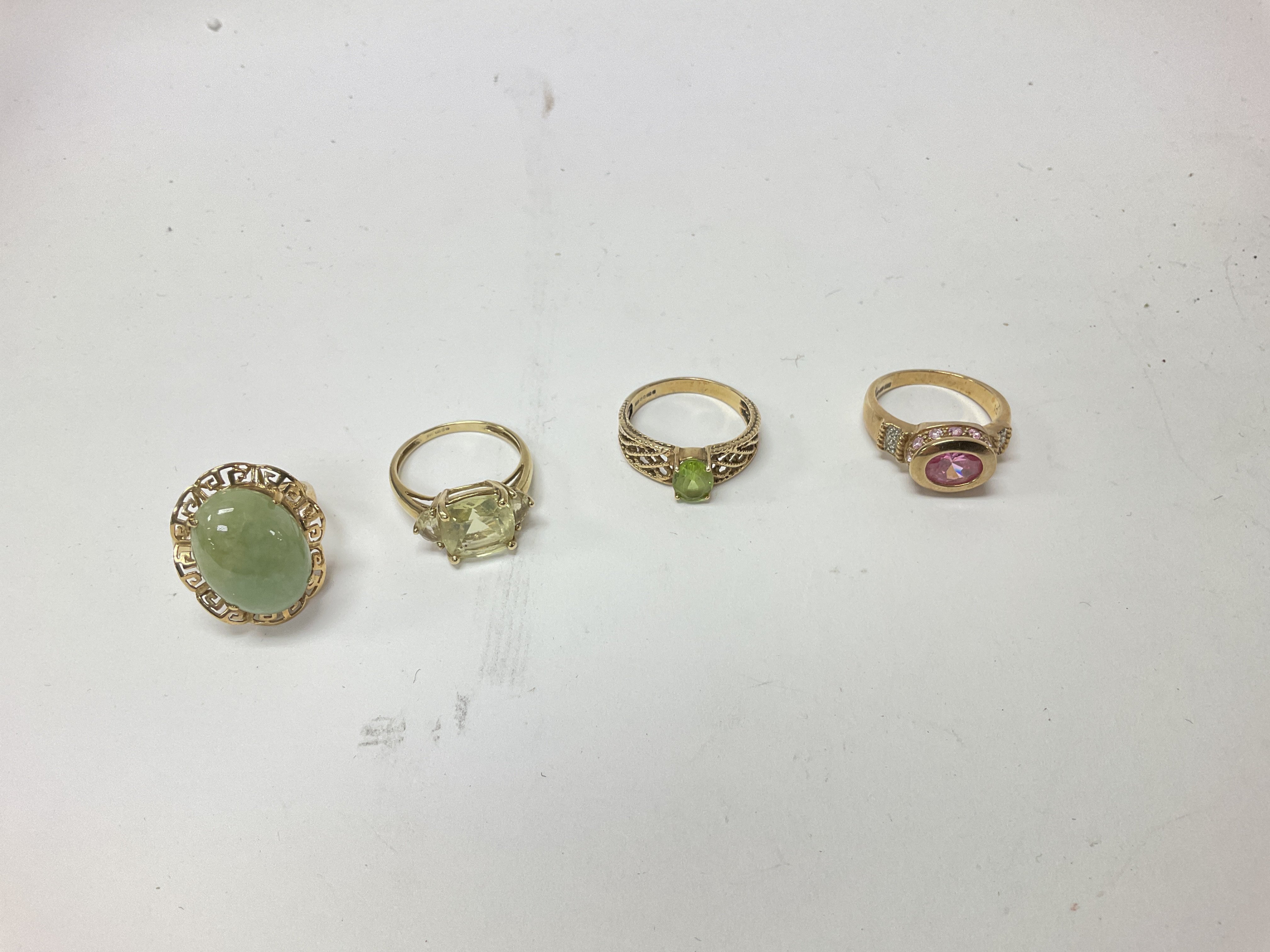 Four 9ct gold stone set rings, approx approx weight 15.92 grams.