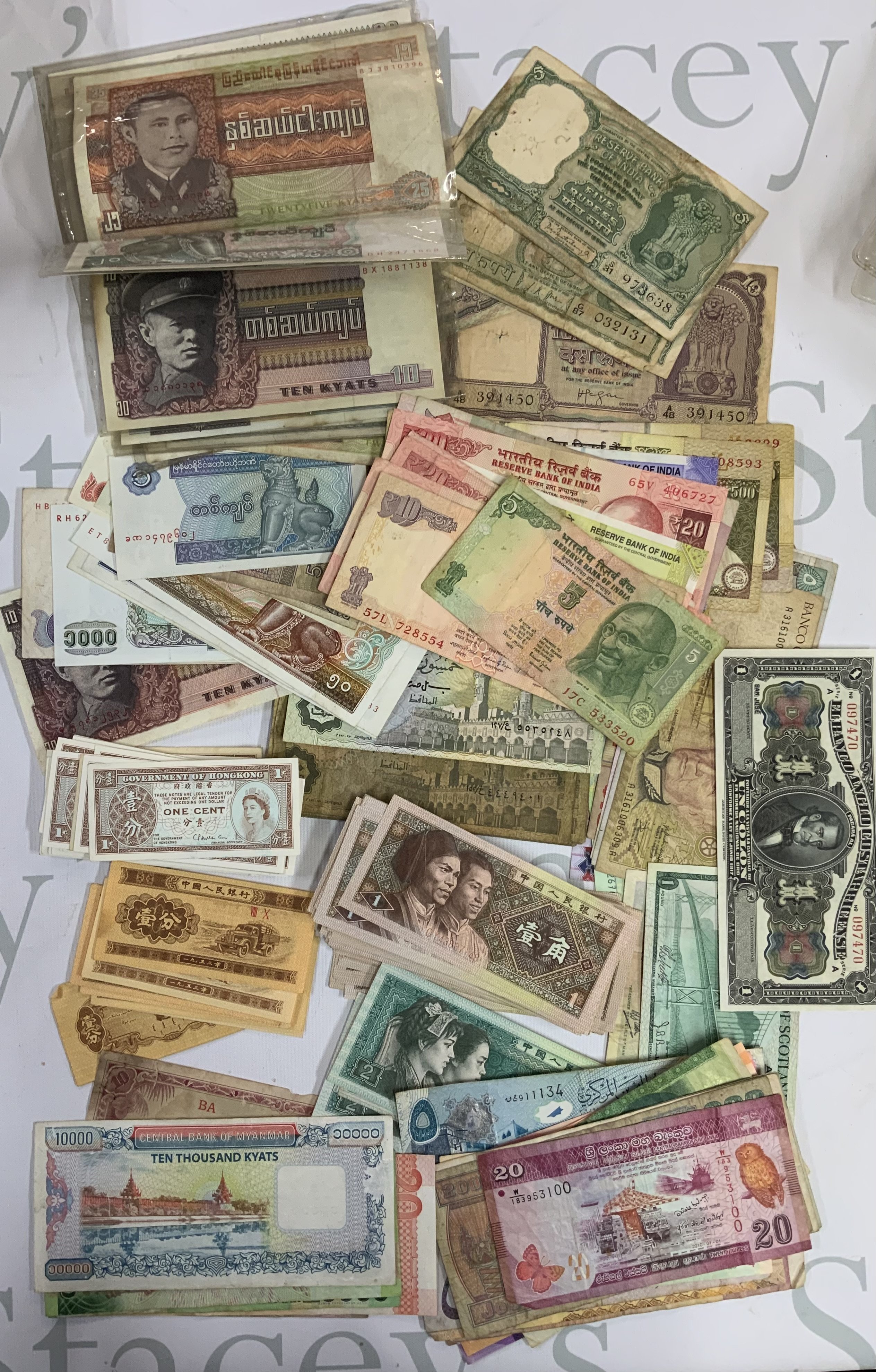 A large collection of world banknotes. (B)