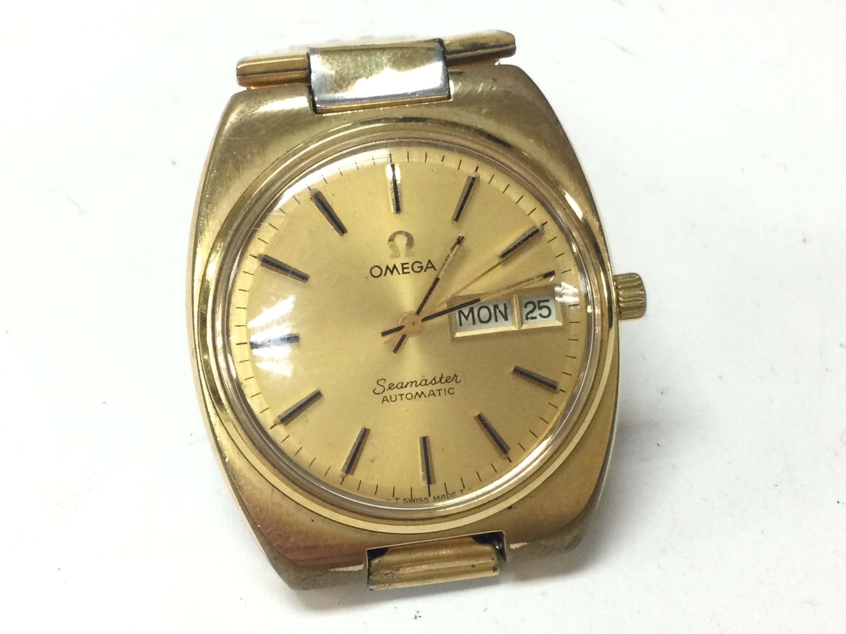 An Omega Seamaster day date automatic wrist watch. Circa 1978 gold plated. Cal 1020. Comes with omega box and outer dust box. Seen running. Postage B