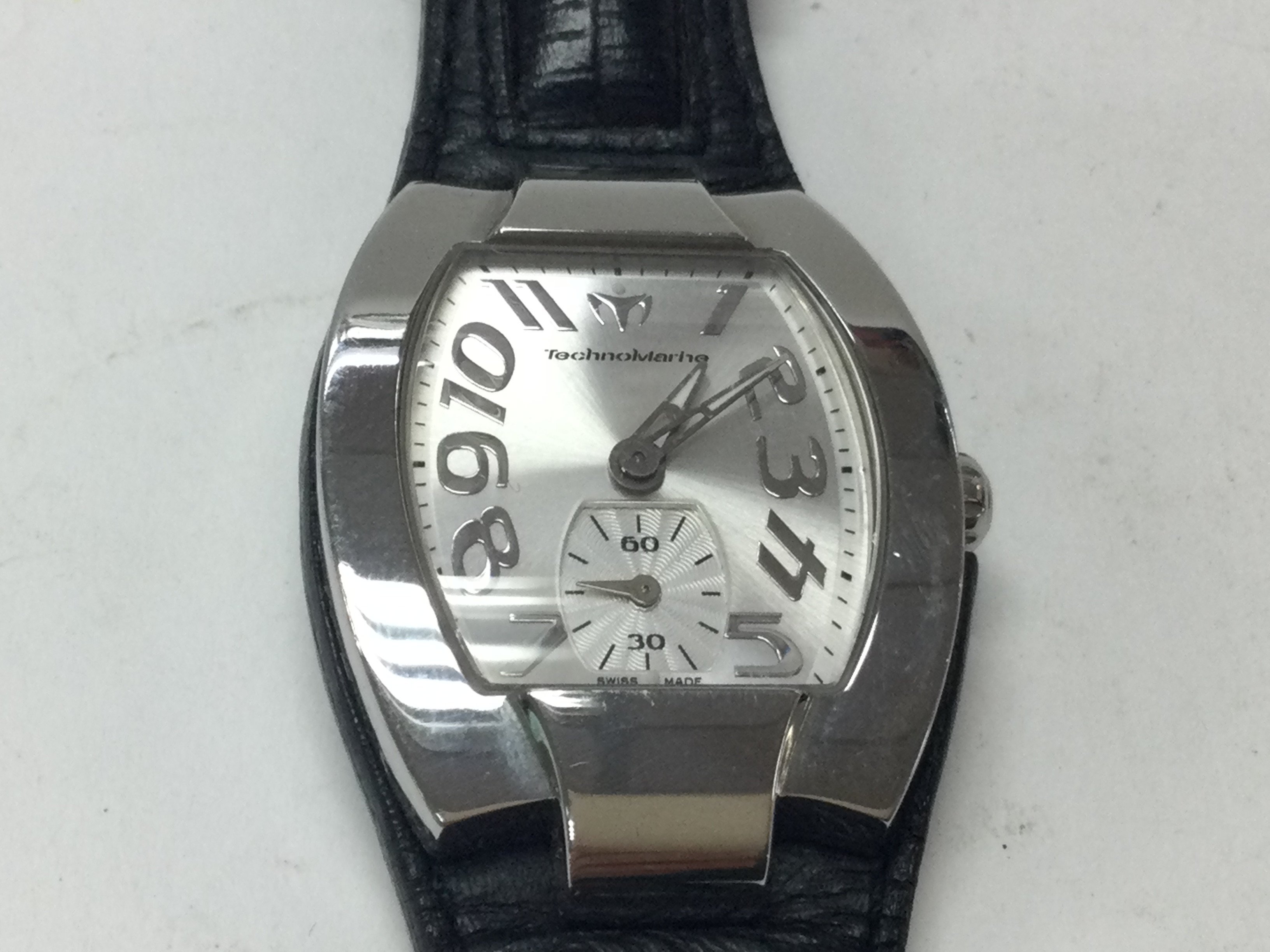 TechnoMarine wrist watch on black leather strap. Seen running. Postage B