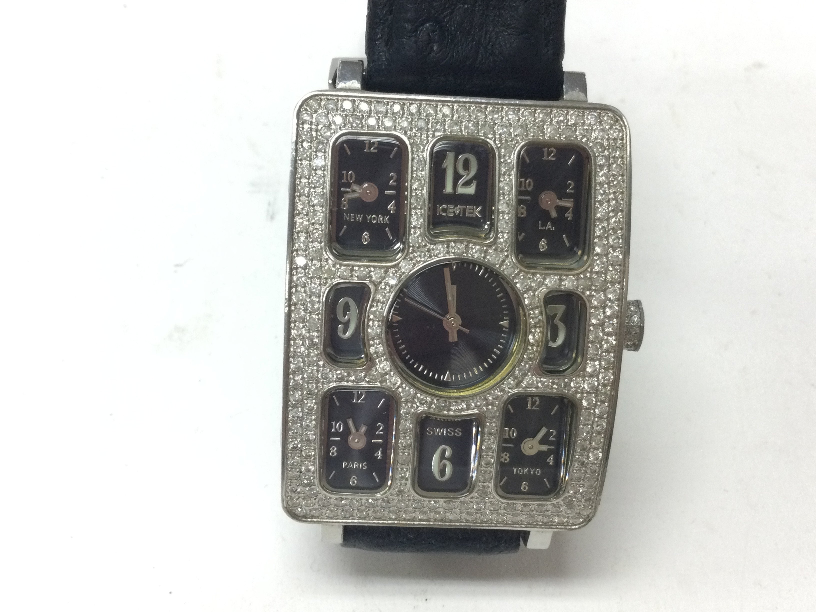 Ice Tek Quintempo diamond watch. Features 5 time zones watch controlled by separate quartz Swiss movements. 50mm face. 4ct diamonds on watch and 1ct on buckle. Postage B