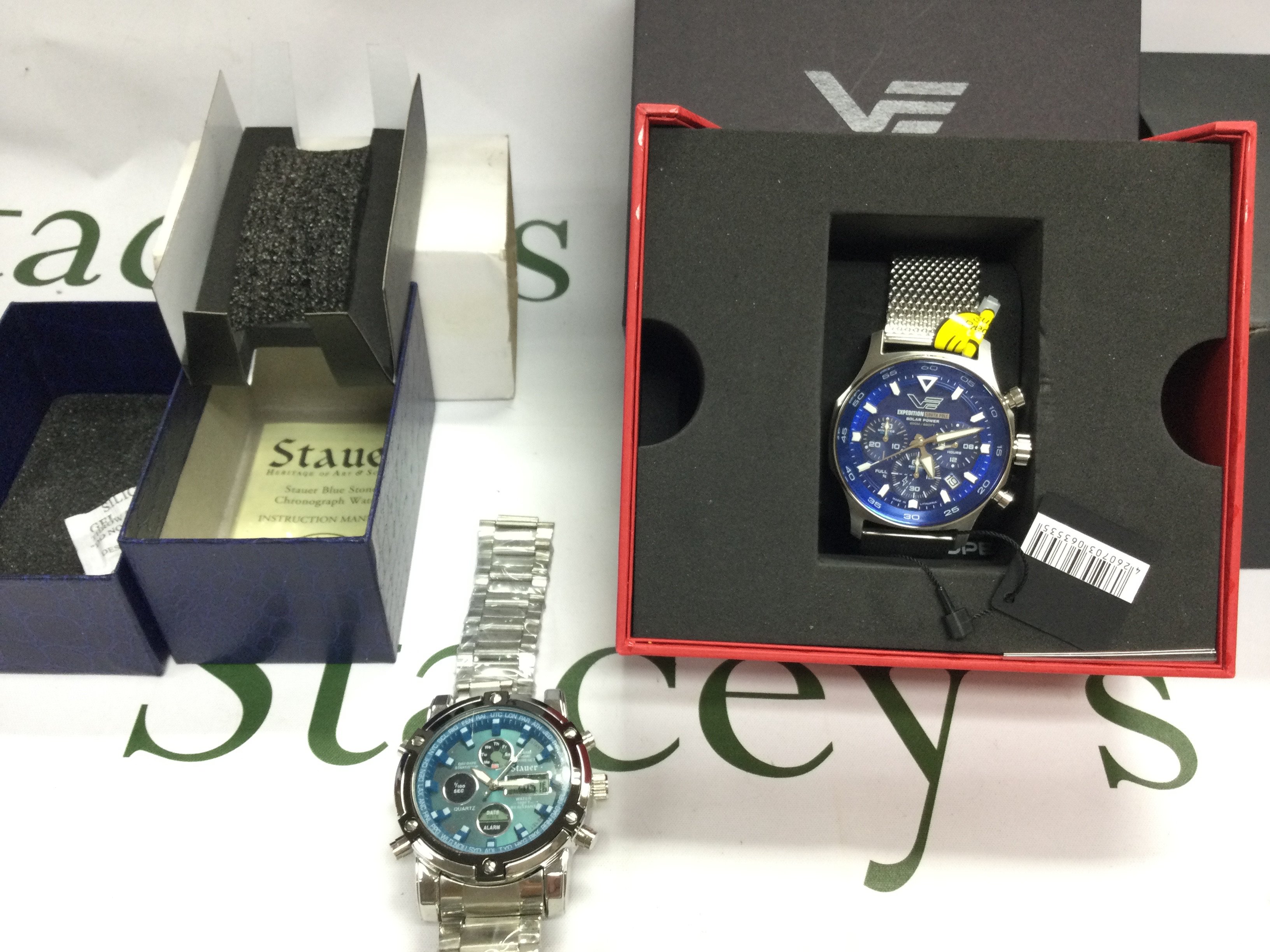 Two gents Chronograph watches including a Vostok Europe and a stauer (link end damaged). Both with boxes and paperwork and seen running. Postage B