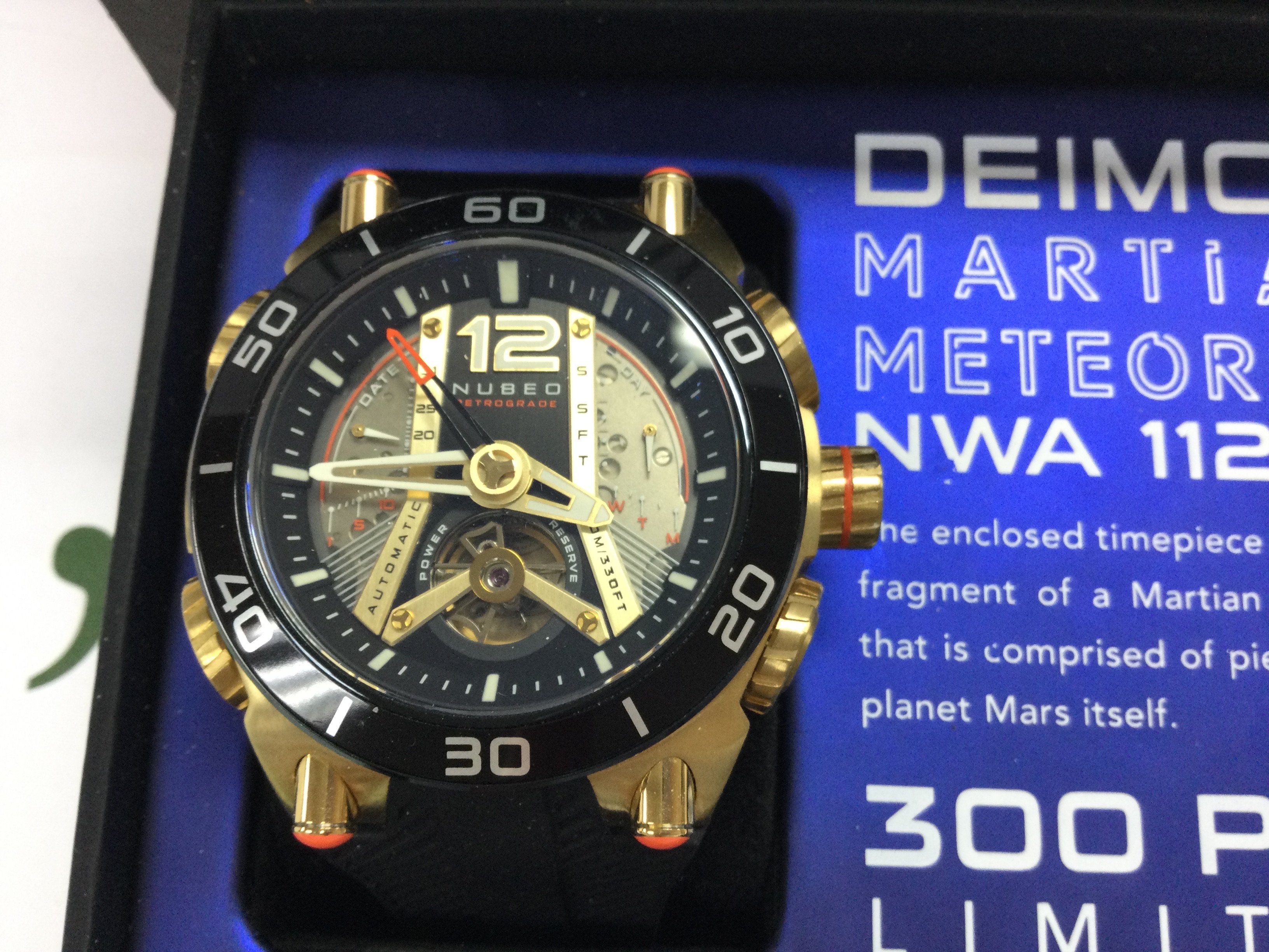 A Nubeo Ltd edition Martian meteorite automatic watch with box and paperwork. In excellent condition. Postage B