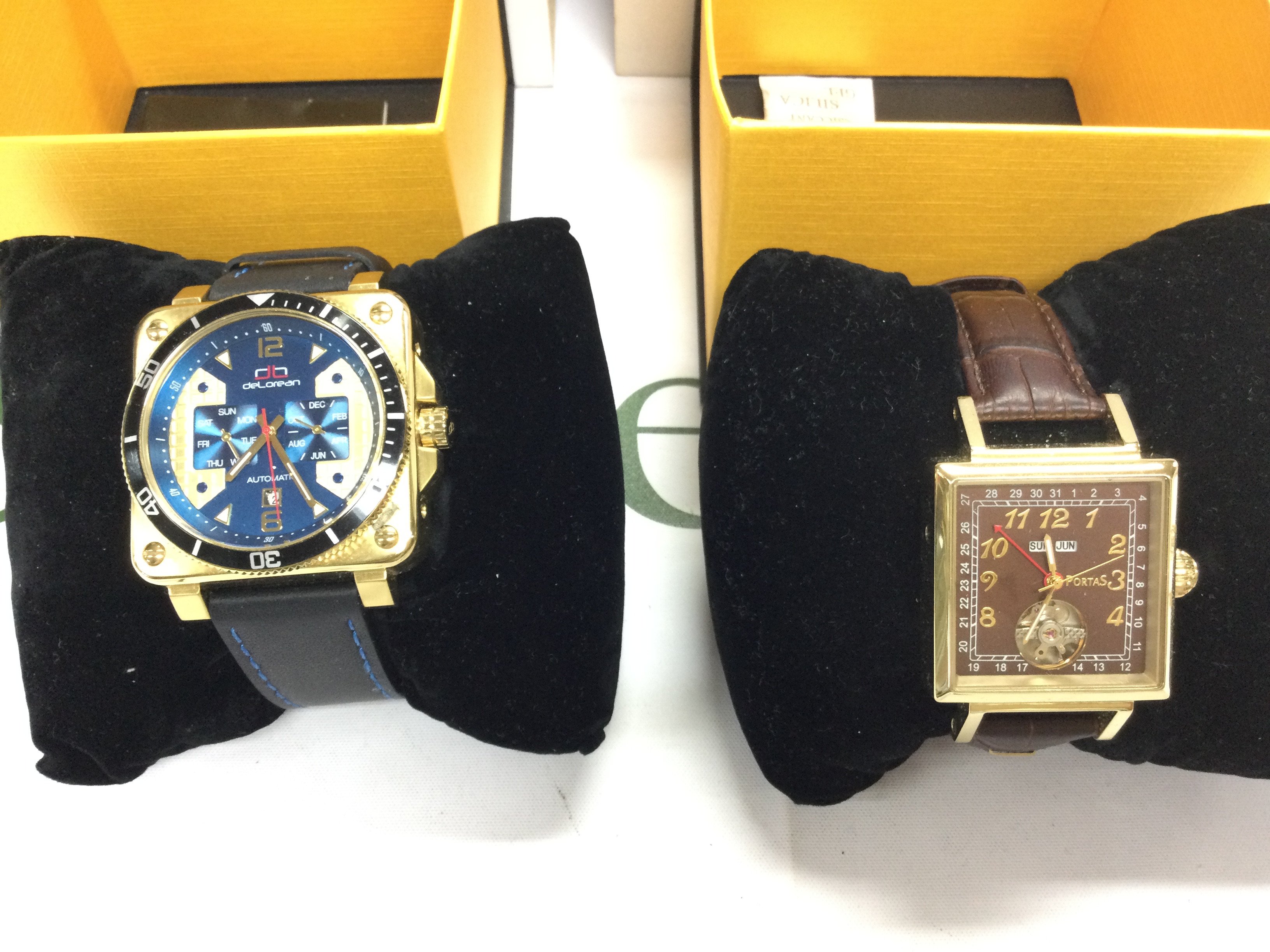 A pair of gents automatic wrist watches both with boxes and in good condition seen running. Postage B