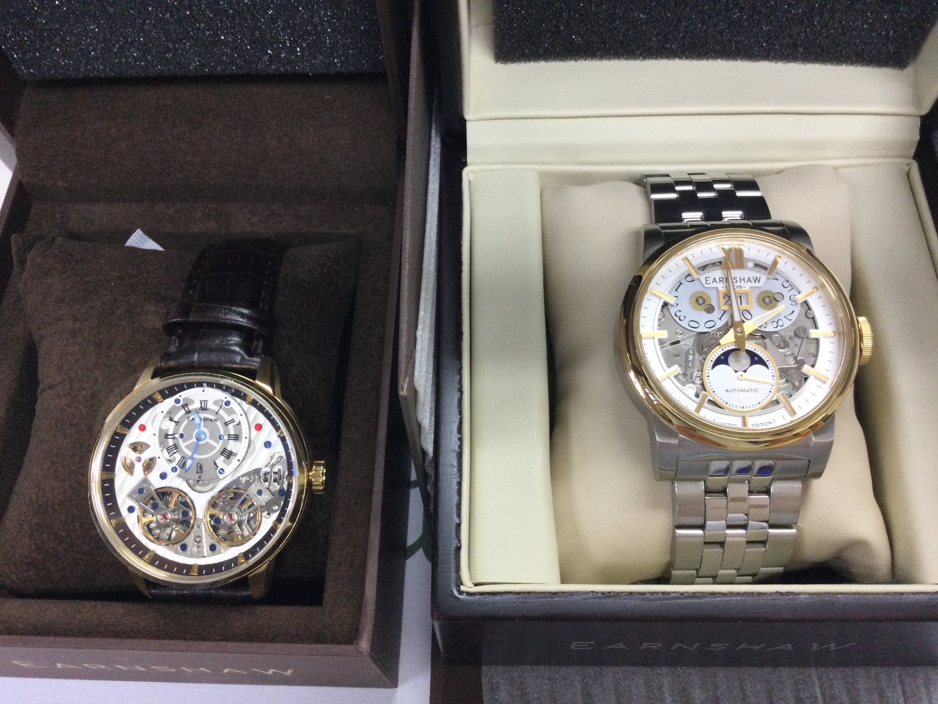 Two Earnshaw automatic wrist watches including a moon phase model. Both in excellent condition and seen running. Postage B