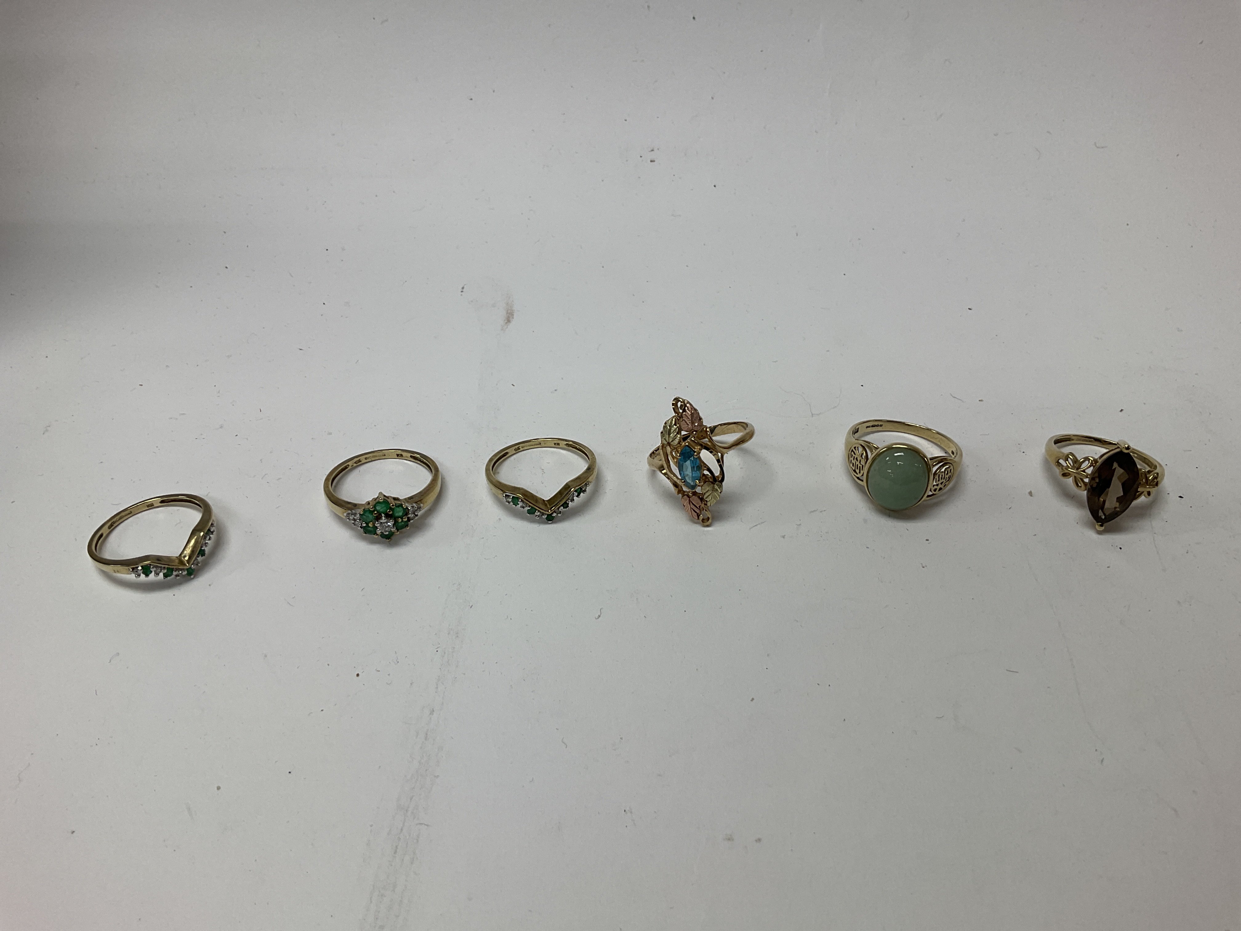 Six 9ct gold stone set rings. Approx weight 14.8 grams .