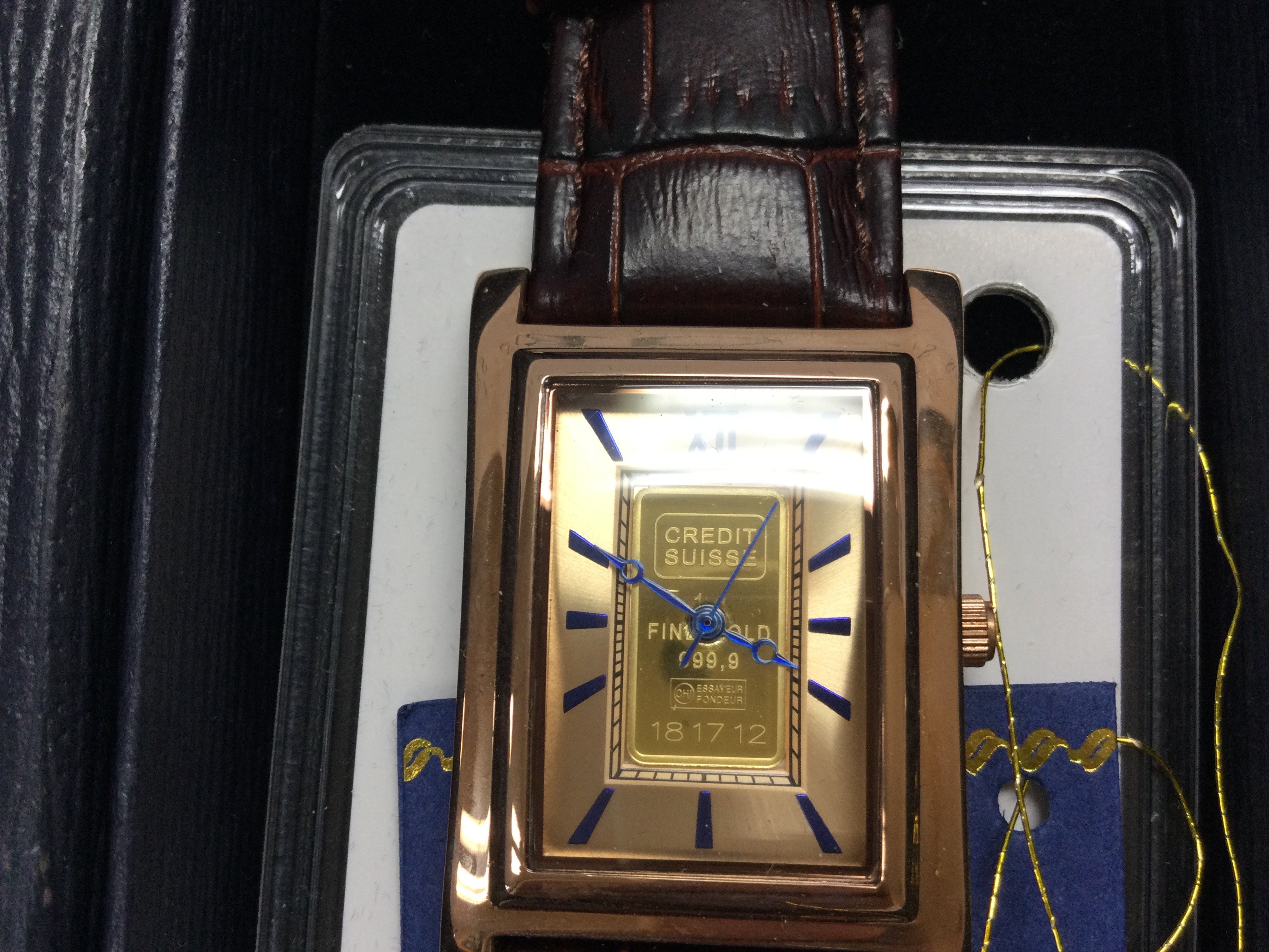 A gents wrist watch containing 1g credit suisse gold ingot. Postage B