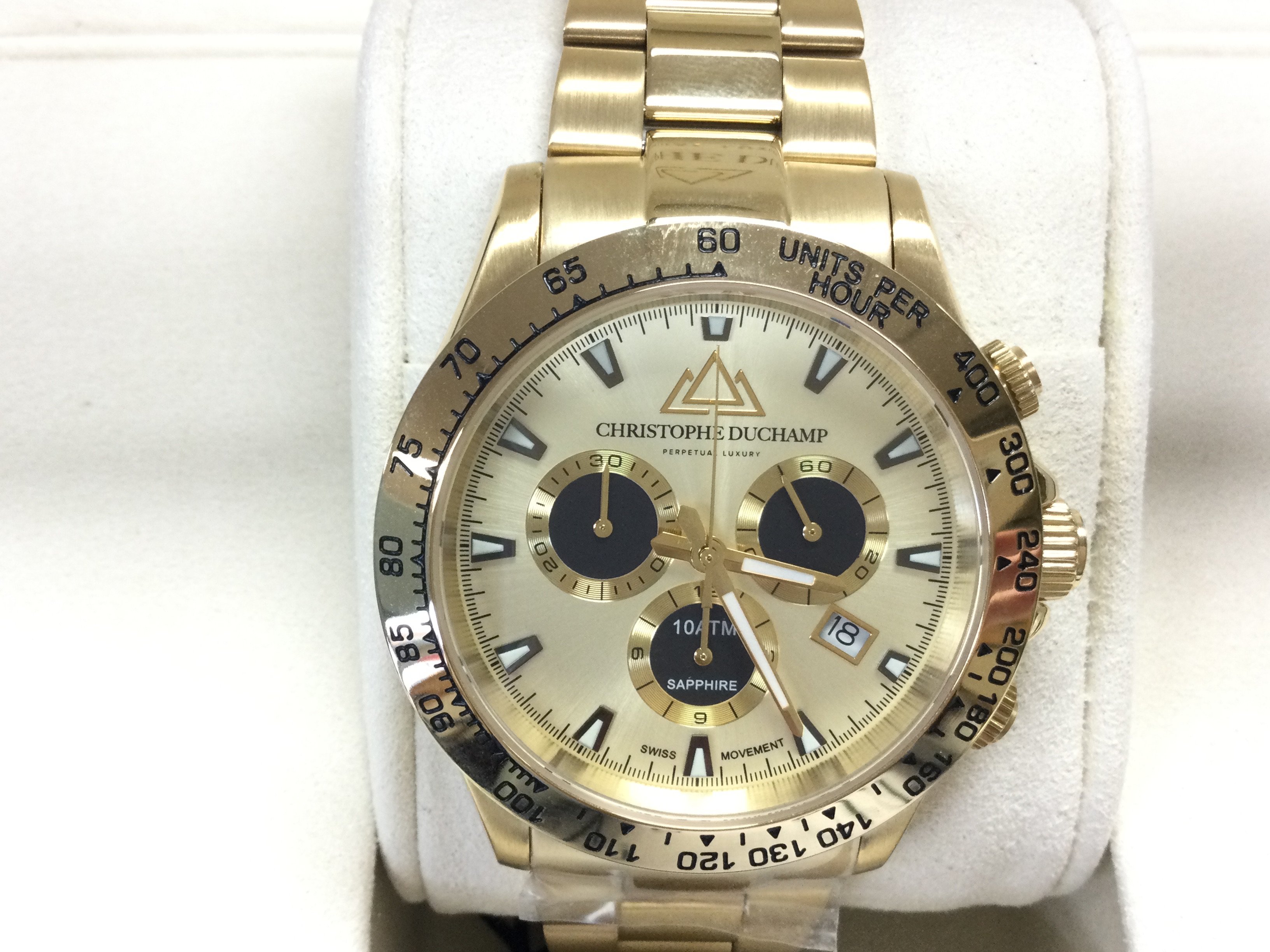 A gents Christophe Duchamp gold tone automatic wrist watch. In unworn condition and seen running. Postage B